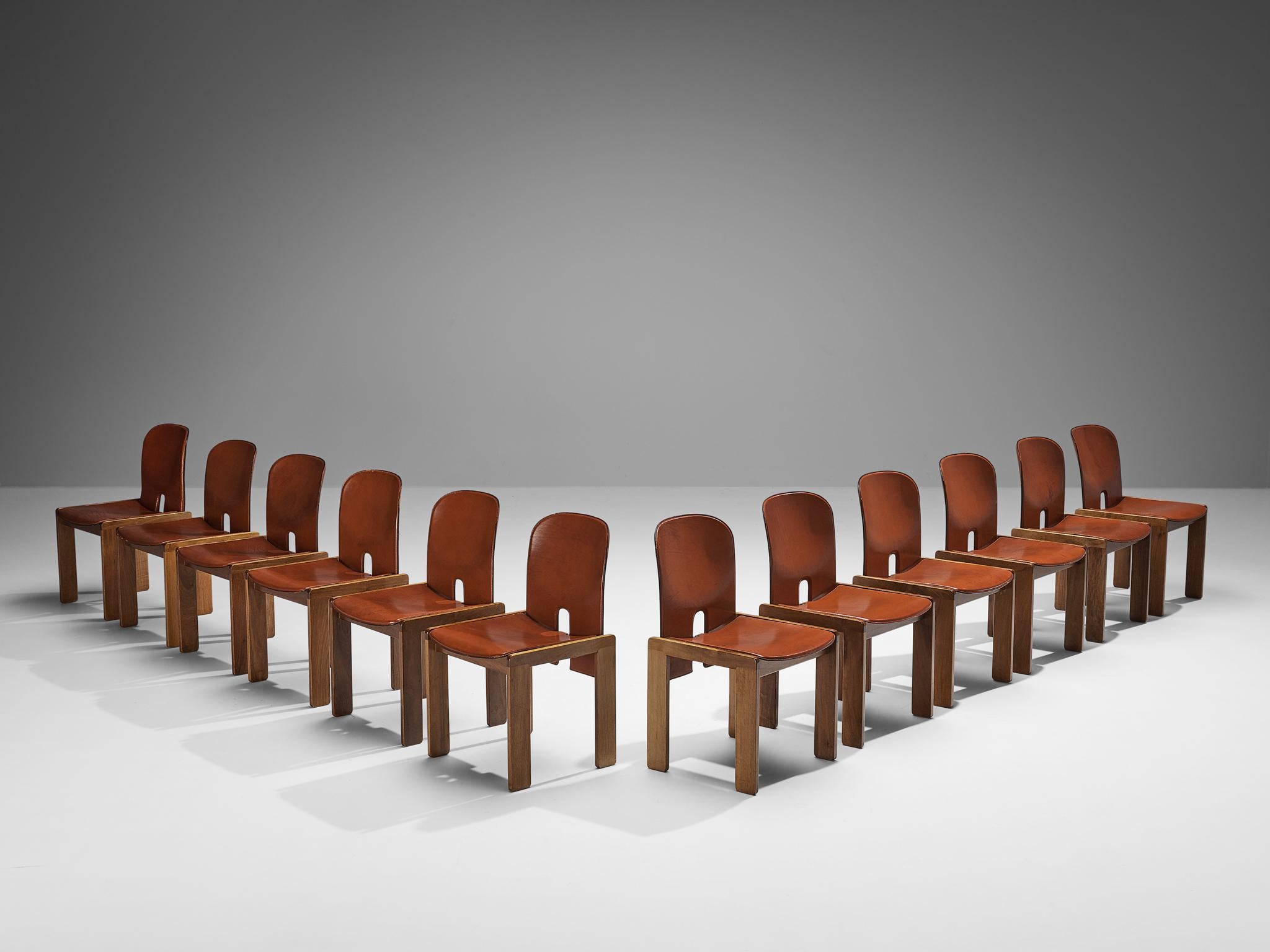 Afra & Tobia Scarpa for Cassina, set of twelve dining chairs model ‘121’, walnut, cognac leather, Italy, design 1965

Set of twelve dining chairs by the Italian designer couple Tobia and Afra Scarpa. These chairs have a cubic and architectural