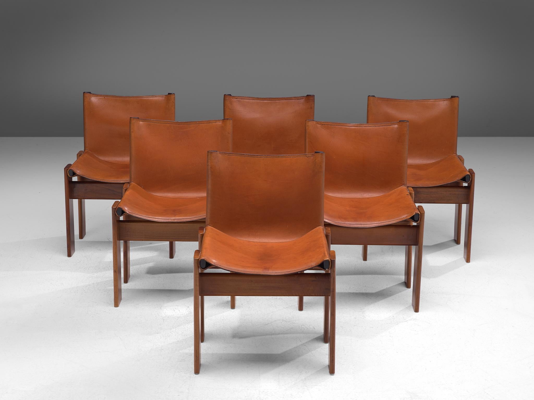 Afra & Tobia Scarpa, monk dining chairs, wood and patinated cognac leather, Italy, 1974.

The wonderfully patinated cognac leather forms a striking combination with the dark walnut wood. Interesting is the 'flat' shape of this chair where the