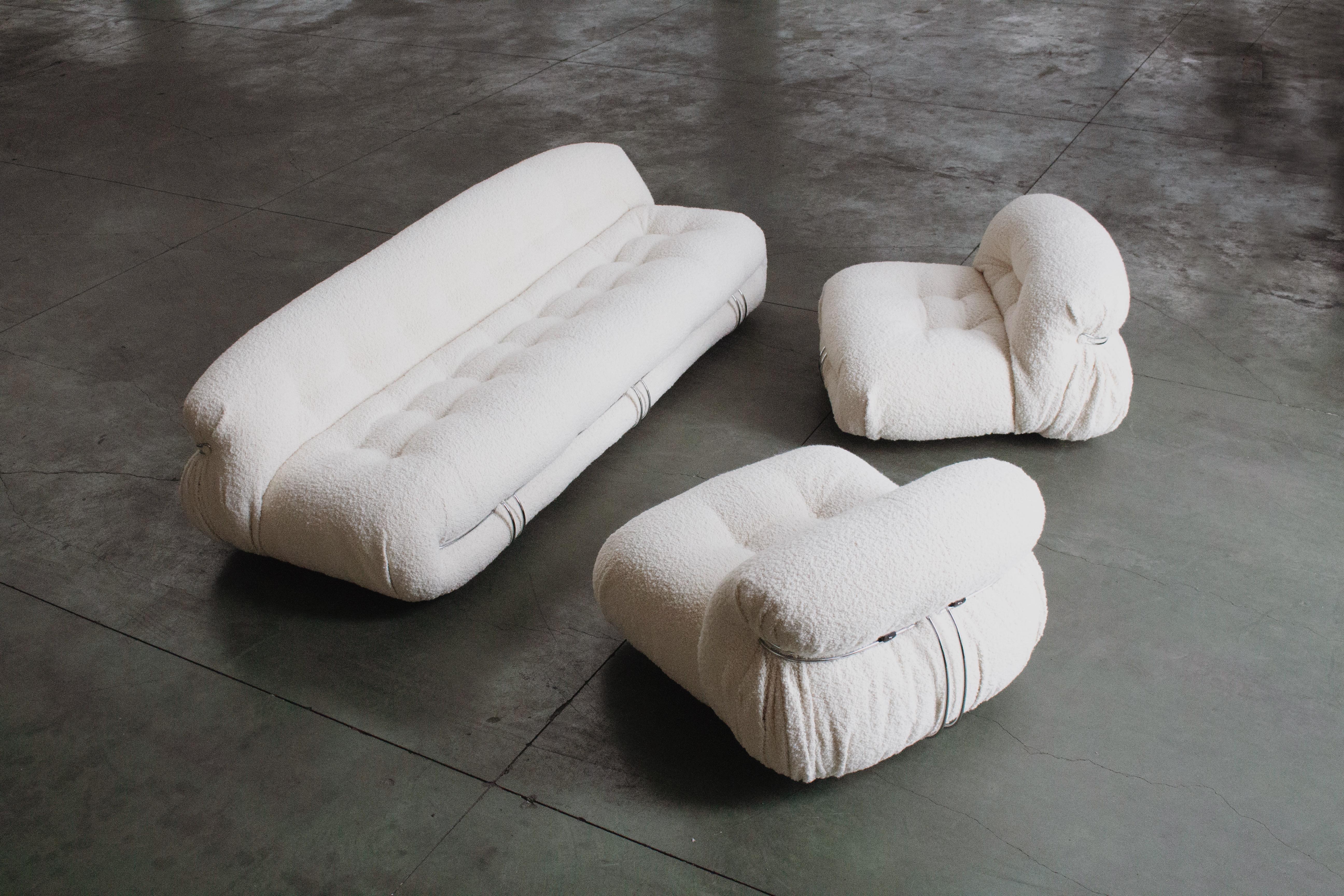 Afra & Tobia Scarpa “Soriana” living room set for Cassina, three-seater sofa and two lounge chairs, ivory bouclé wool and chromed steel, Italy, 1969, set of three. 

Although technically designed in the 1960s, the 