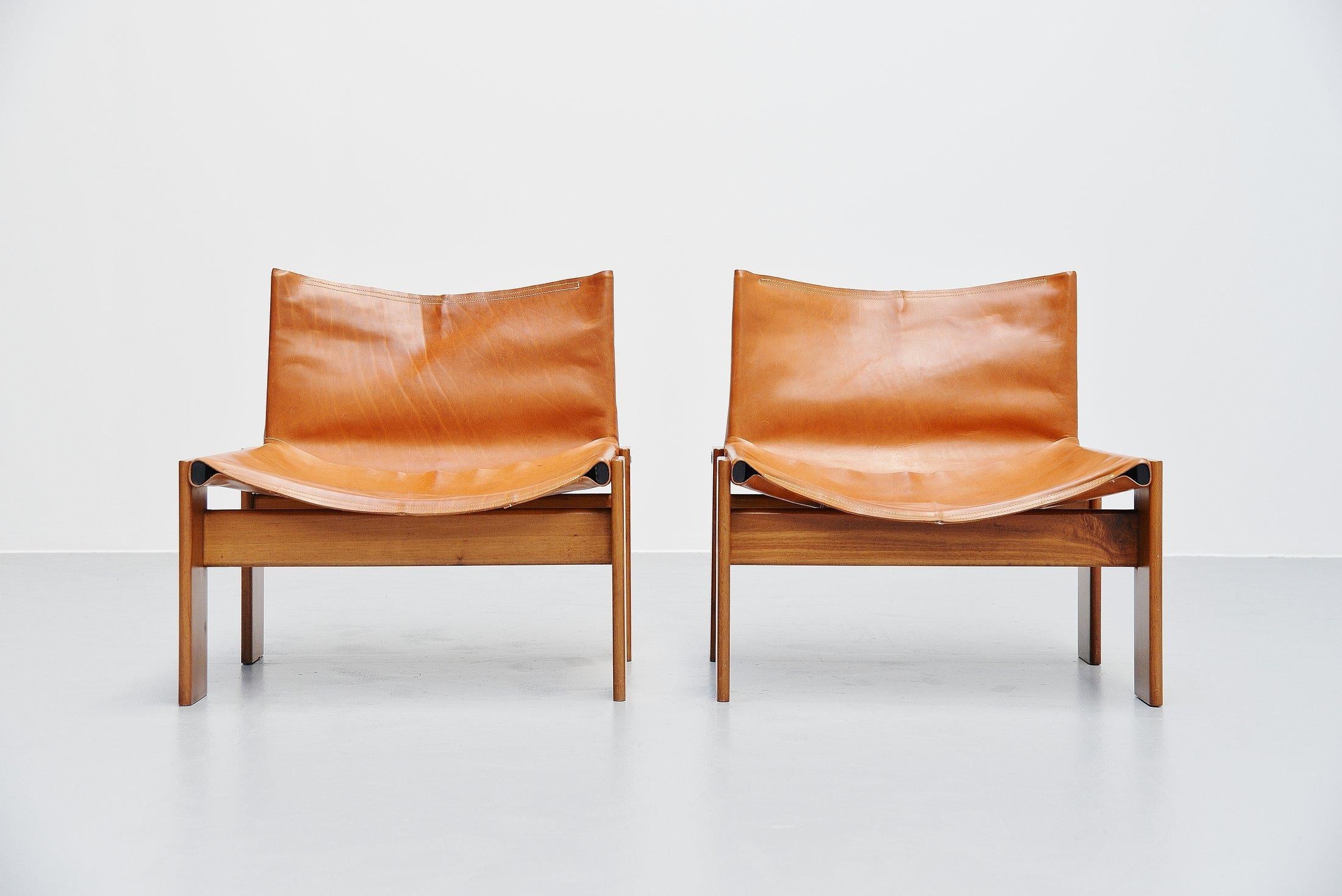 Super rare low 'Monk' lounge chairs designed by Afra e Tobia Scarpa and manufactured by Molteni, Italy 1974. These chairs have solid walnut legs and natural leather seats. I have never seen these low lounge chairs and also cannot find them on the