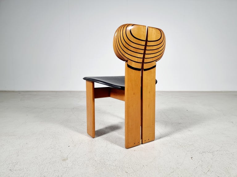 Afra & Tobia Scarpa for Maxalto, 'Africa chair', black leather, walnut, ebony, and brass, Italy, 1970s

Part of the Artona collection by Maxalto. The drawing on the back of this set is exquisite and highlights the natural form of the walnut wood.