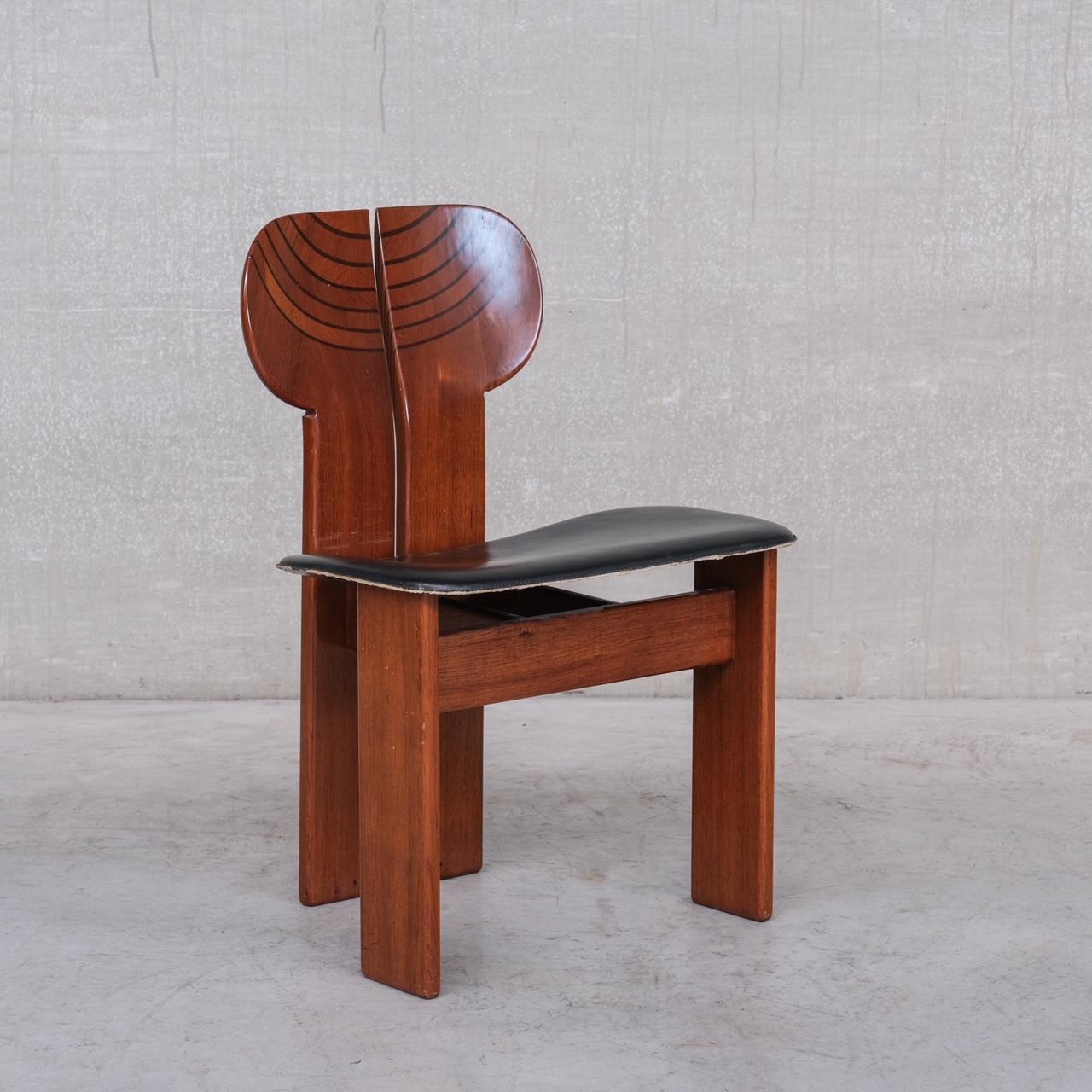 A set of six dining chairs, the scarce 'Africa' model.

Designed by Italian designers Tobia and Afra Scarpa. 

Italy, c1975. 

Walnut, ebony, brass and black leather. 

An exceptional collectable mid-century design. 

The original leather