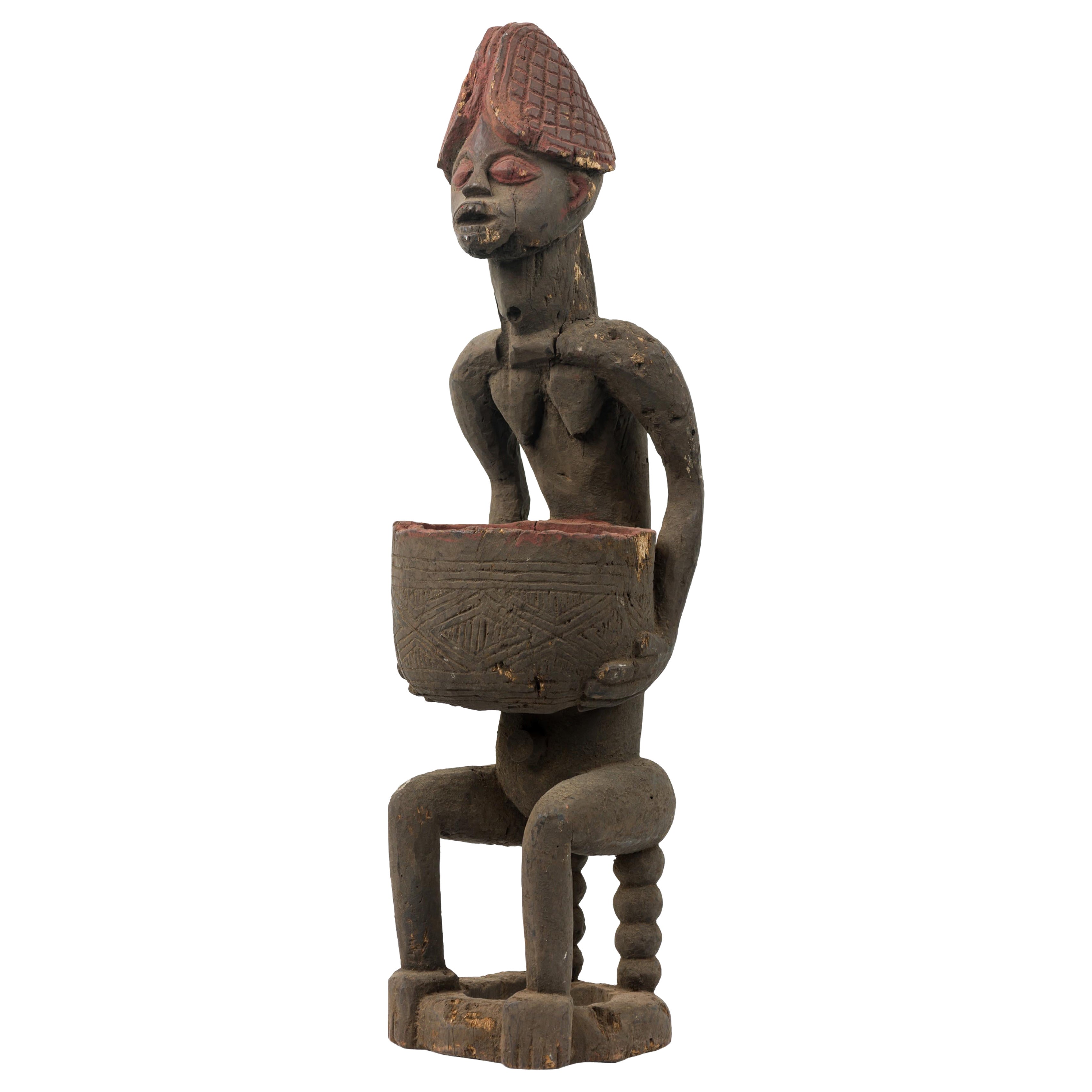 African 20th-Century Yoruba Carved Wood 
Terracotta Seated Female Figure