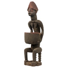 African 20th-Century Yoruba Carved Wood 
Terracotta Seated Female Figure