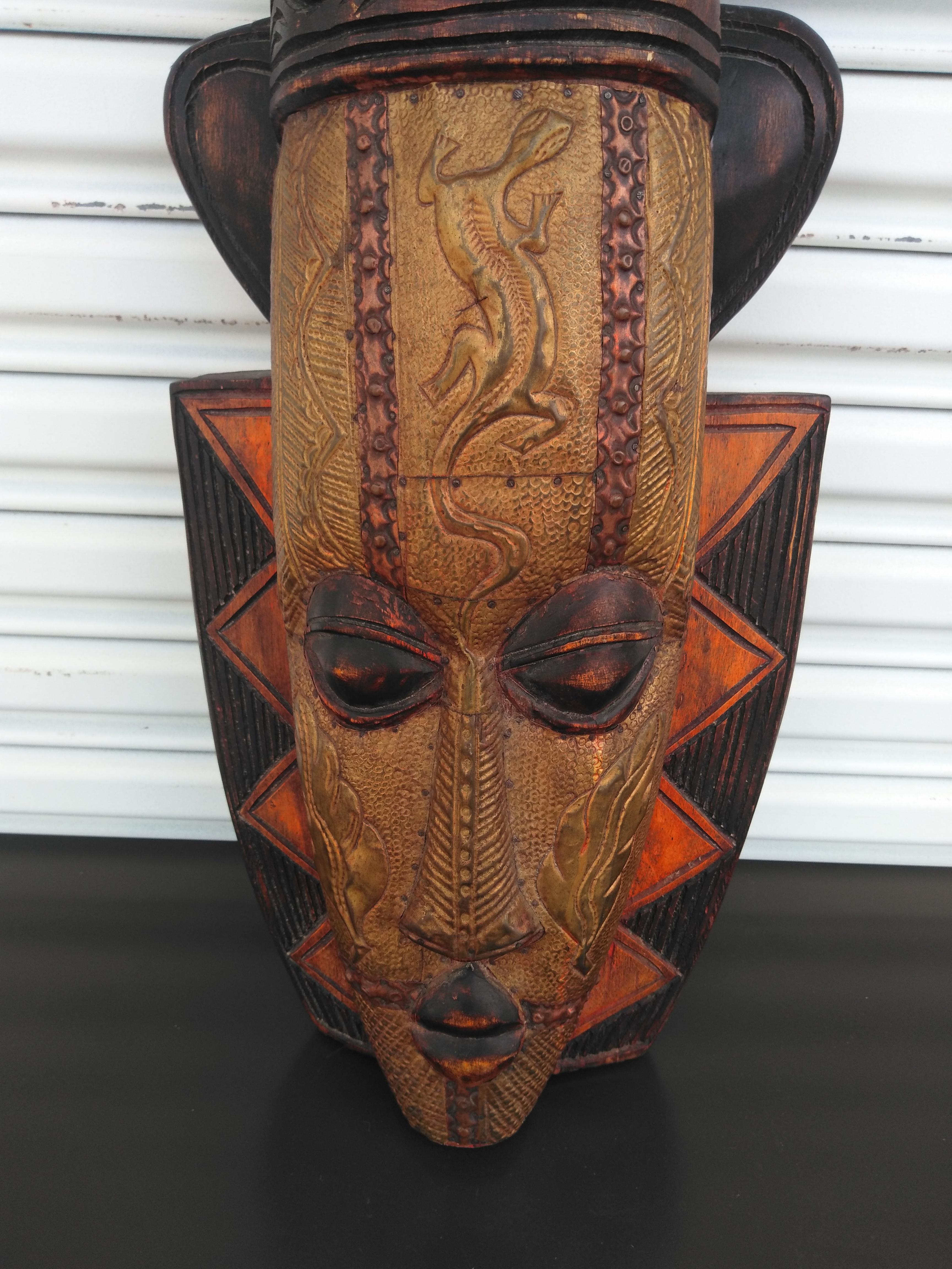 This is a fertility mask called an AKUABA.
It's a ceremonial mask of the Akan tribe of Ghana. 