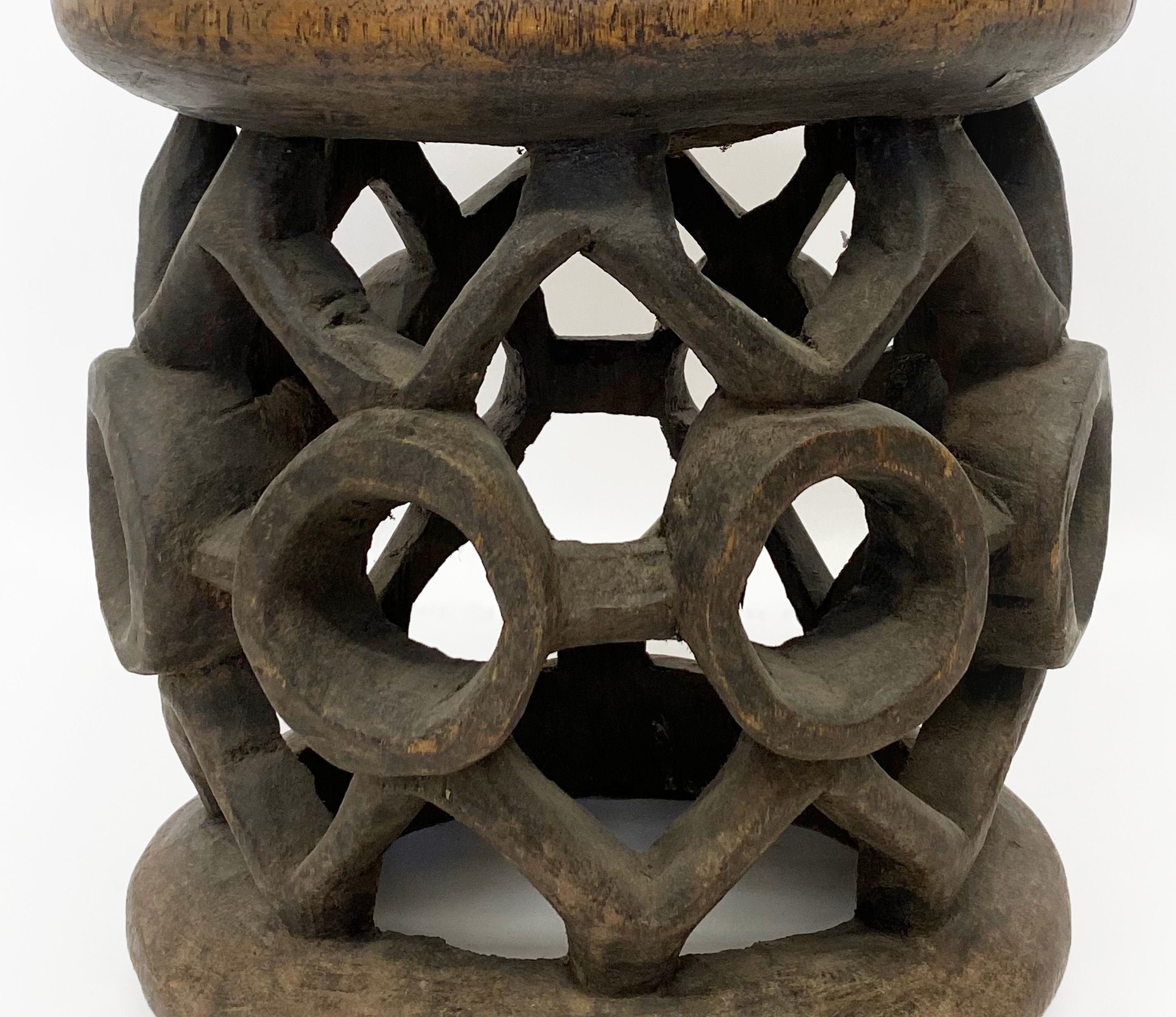 Beautifully hand made african Bamileke stool. Bamileke stools are carved from a large single piece of wood. Traditionally used in ceremonial seating by the Bamileke tribe of Cameroon.