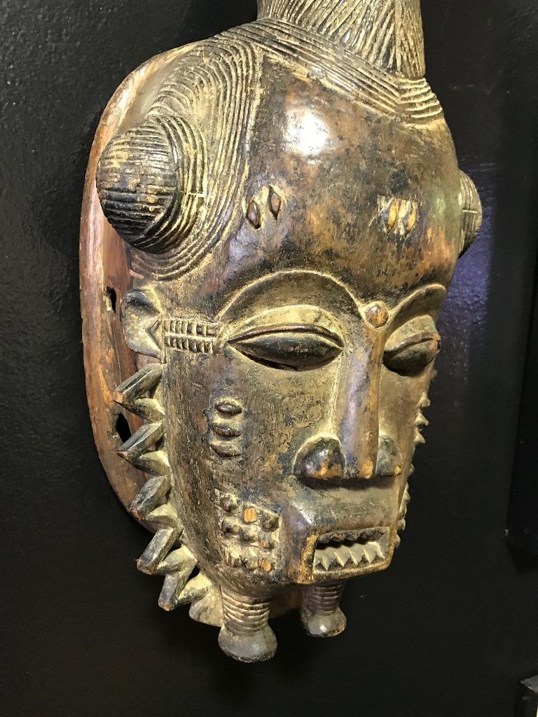 This is truly a fantastic piece. Well made with signs of age (when found, had original information attached to the backside of mask. Please see photo). Made by the Baule peoples of the ivory coast. This mask was apparently made for a tribal