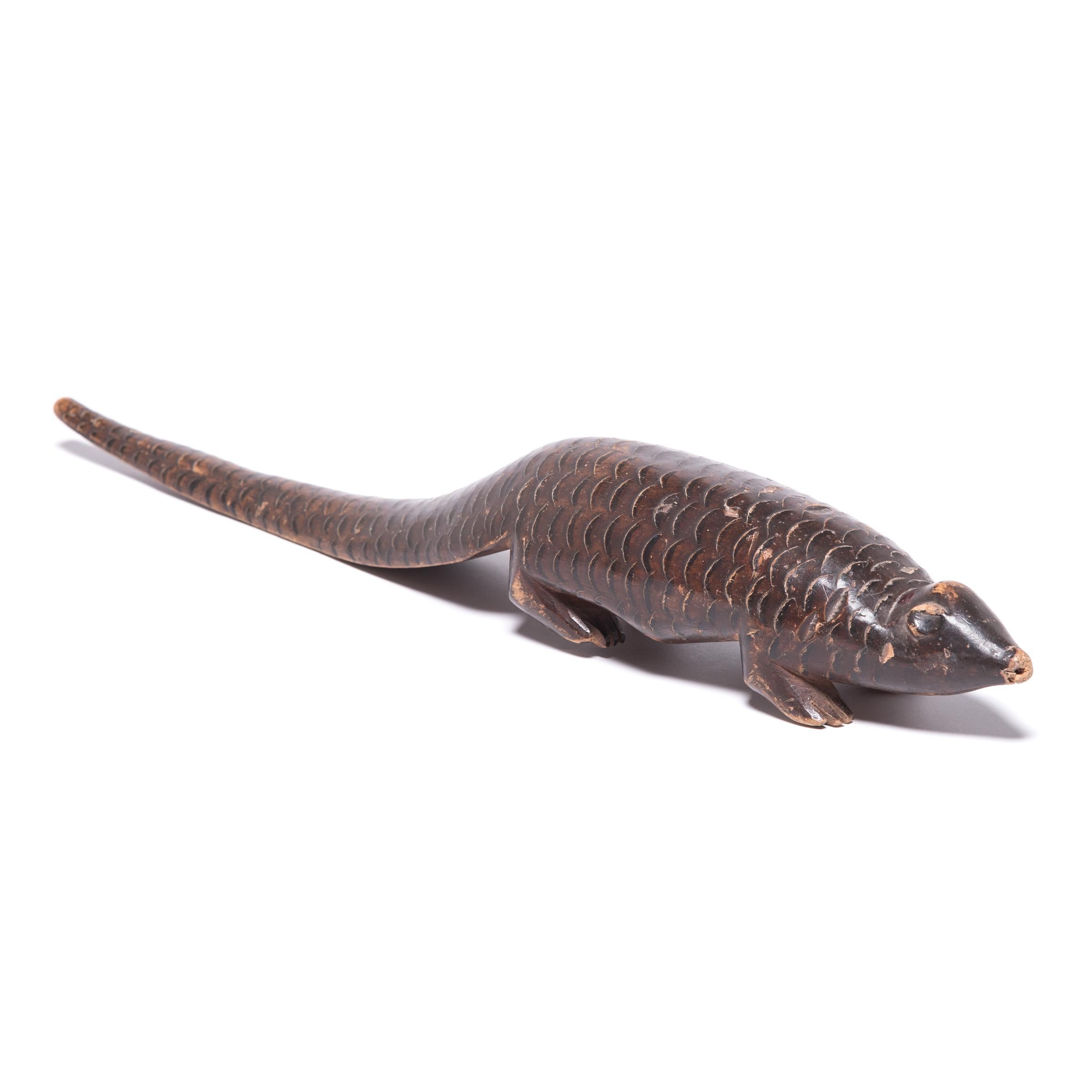 The Bete tribe saw the spirits of their elders as emissaries to nature in the spirit world. Their religious ceremonies centered around mediating that relationship, and would have used effigies of animals, like this charming wooden pangolin. To that