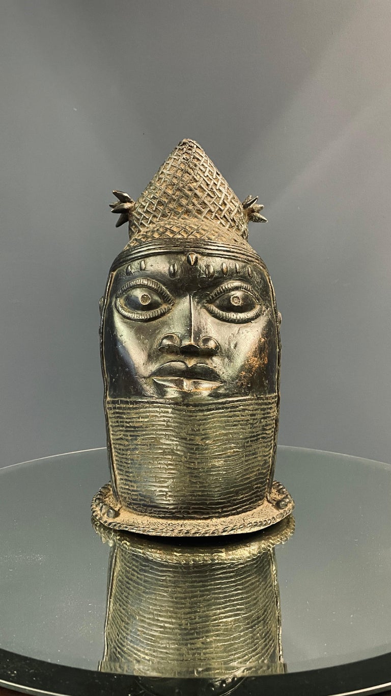 Made by the Yoruba Tribe from Benin. Created for the royal palace & for the Oba (Queen), this hand-crafted bronze will add spirit & attract attention wherever it is!.