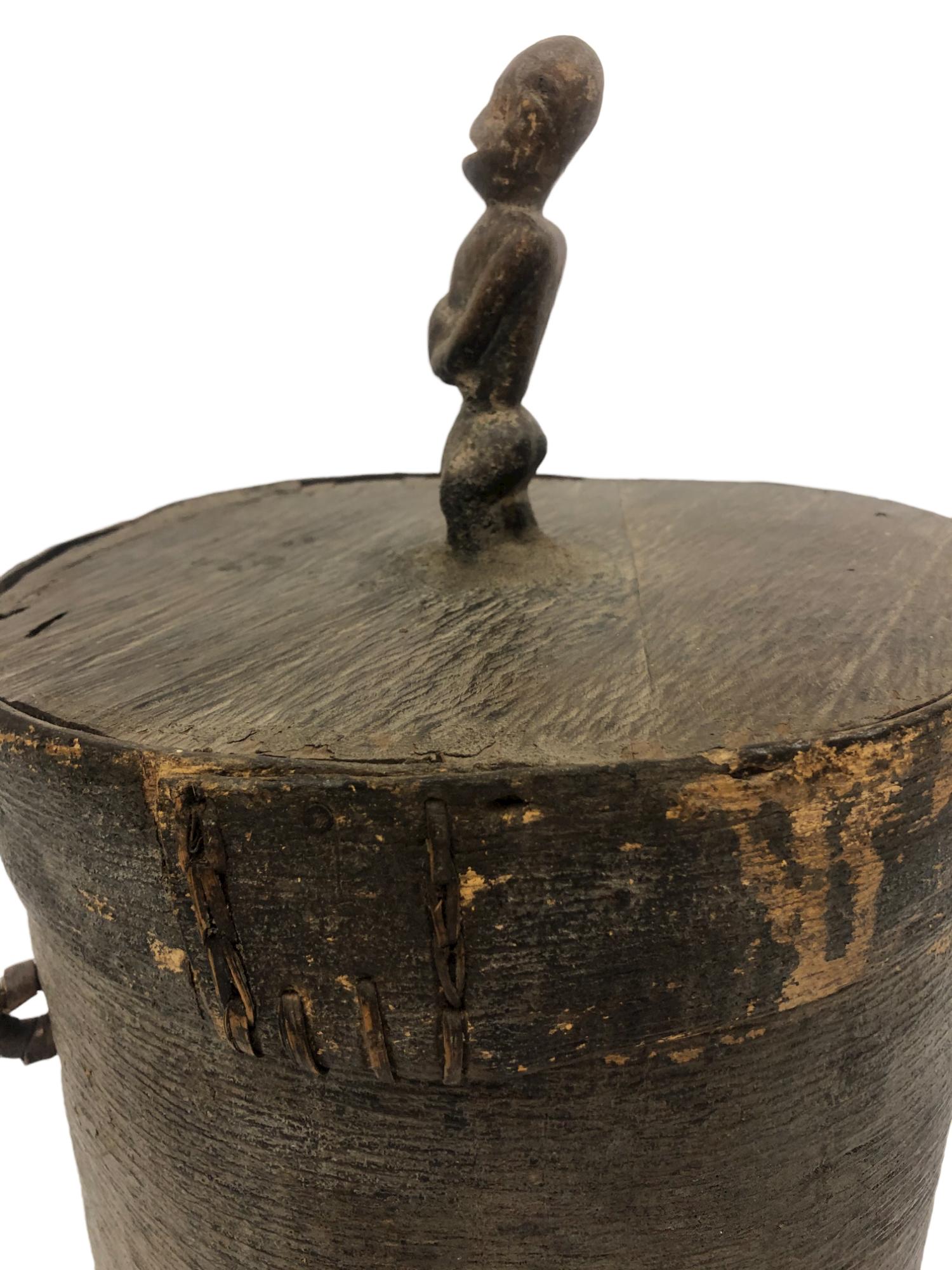 African bentwood canister with carved wood figurine with exquisite hand stitching. 

Property from esteemed interior designer Juan Montoya. Juan Montoya is one of the most acclaimed and prolific interior designers in the world today. Juan Montoya