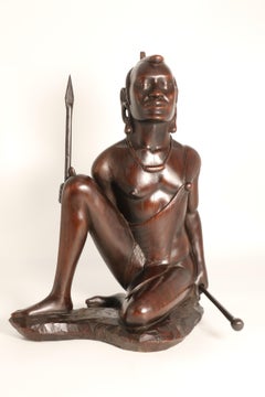 African carved hardwood figure of a Maasai warrior, signed, circa 1930