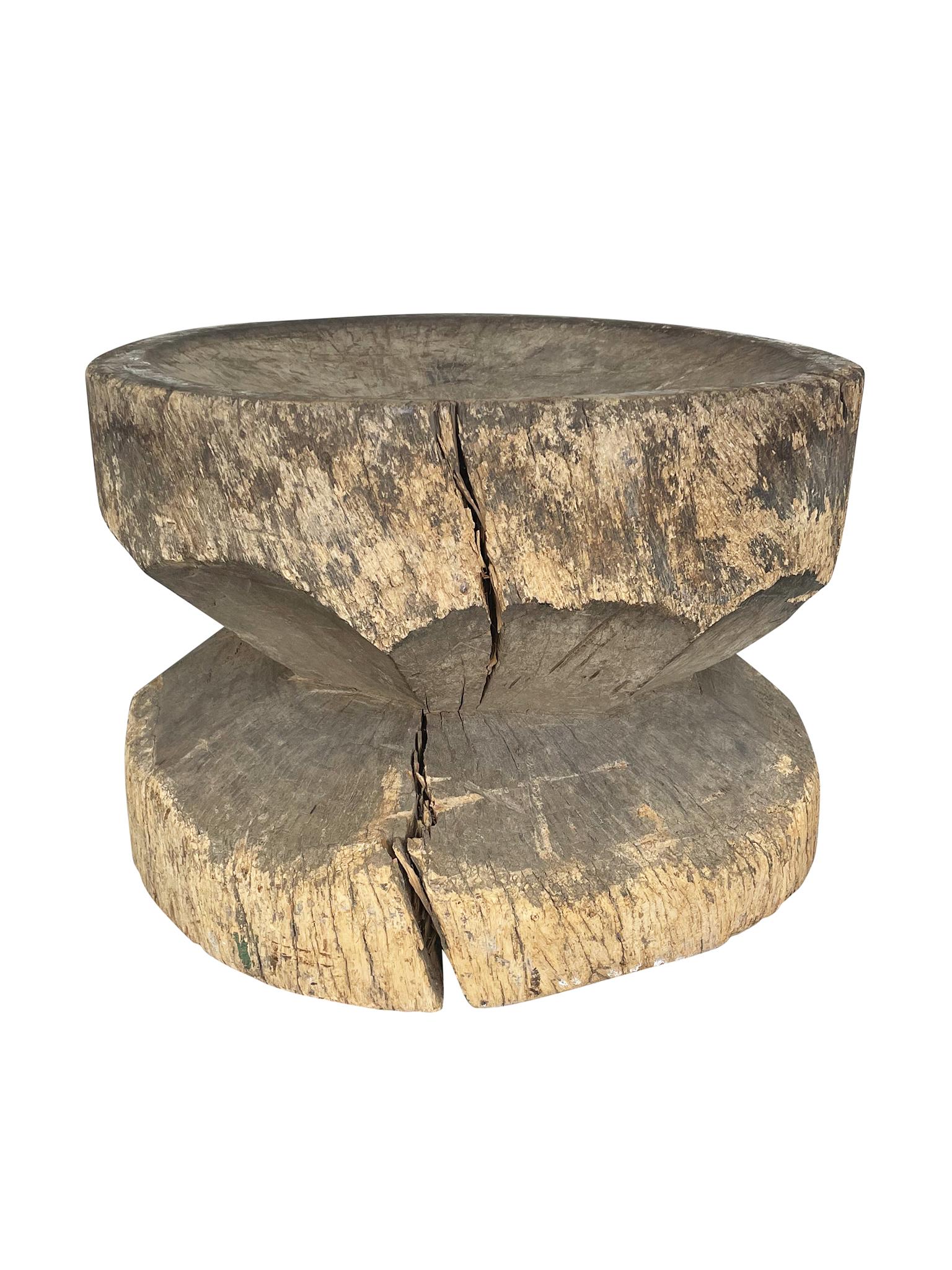 This round side table was hand-carved in the 20th century. We love its richly textured, hewn surface and the wood's organic properties.

Dimensions:
23.5 in. diameter
17.5 in. height

Condition notes:
In good condition, with natural splitting