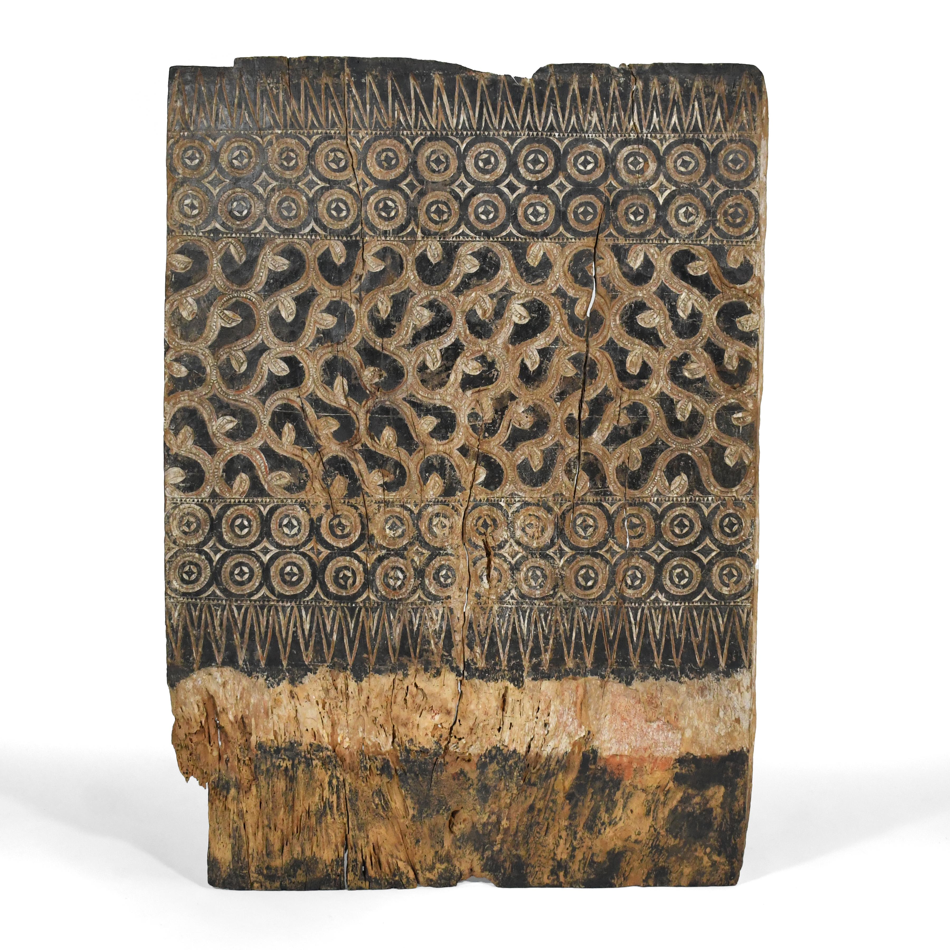 This powerful piece was originally a door, but removed from its context, it becomes a dynamic abstract artwork. Bands of repeating patterns and a heavily distressed patina from age and use activate the surface and create great visual