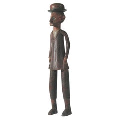 African Colonial Sculpture of a Man in a Bowler Hat Circa 1900