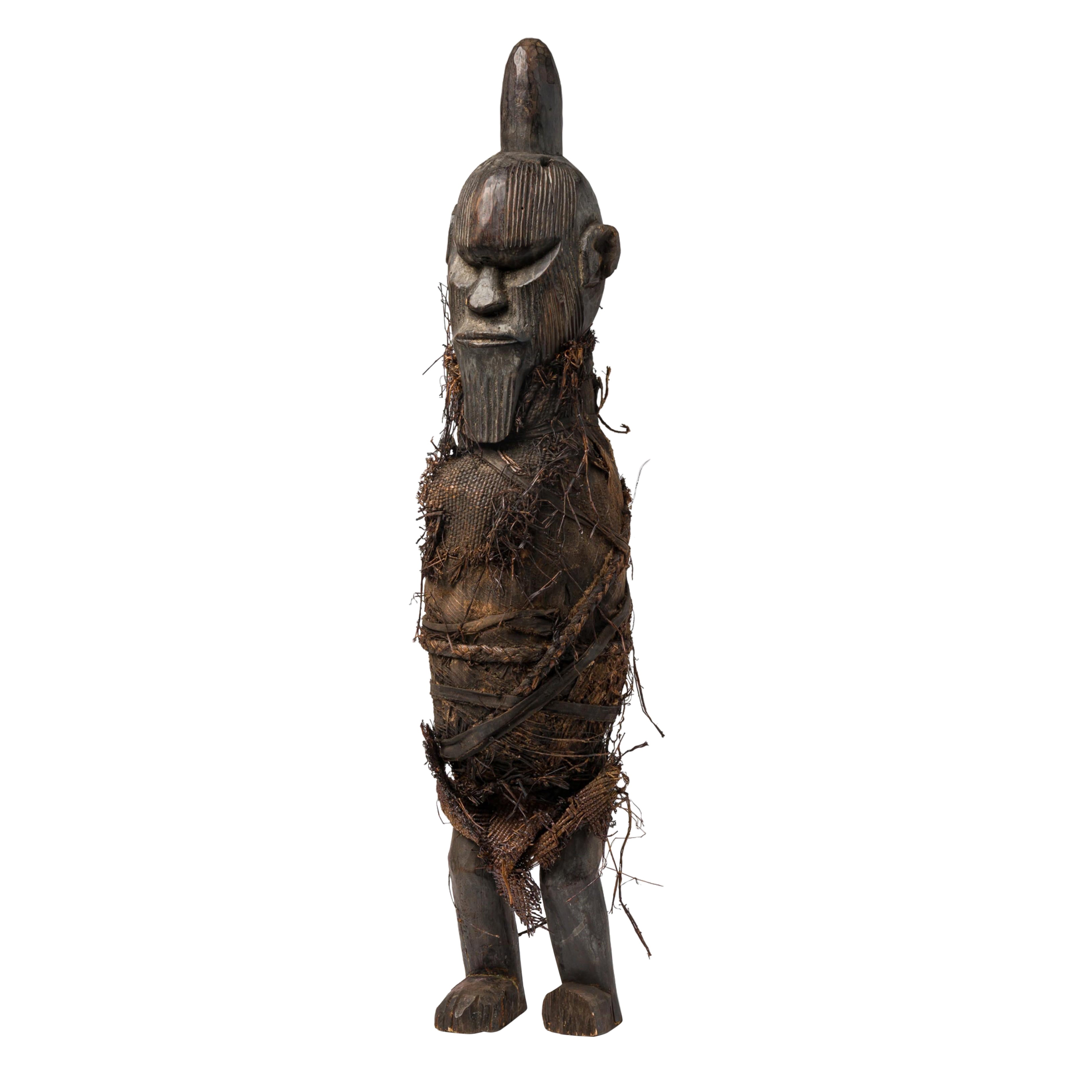 What are carved wood figures in African art?