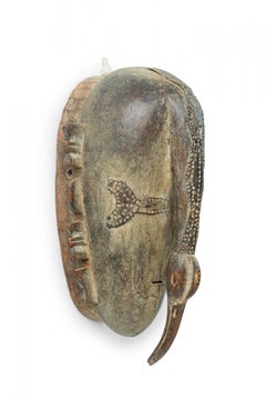 African Cote dVoire 20th Century Wood & Brass Do Society Ligbi Hornbill Mask