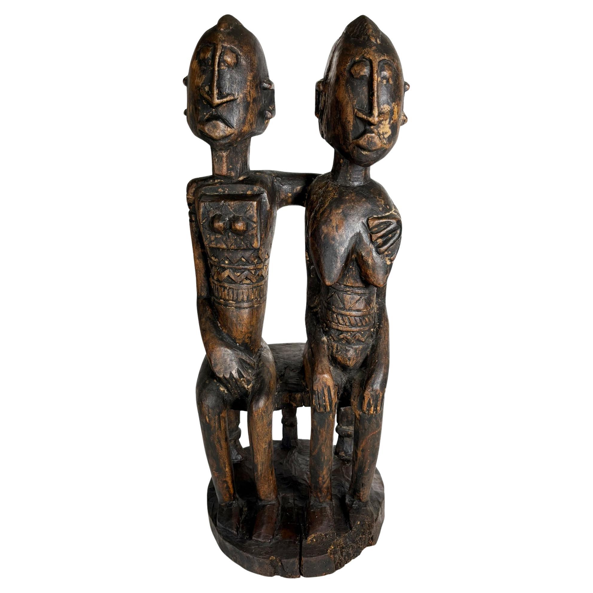 African couple sculpture in patinated black wood, 1960, France For Sale