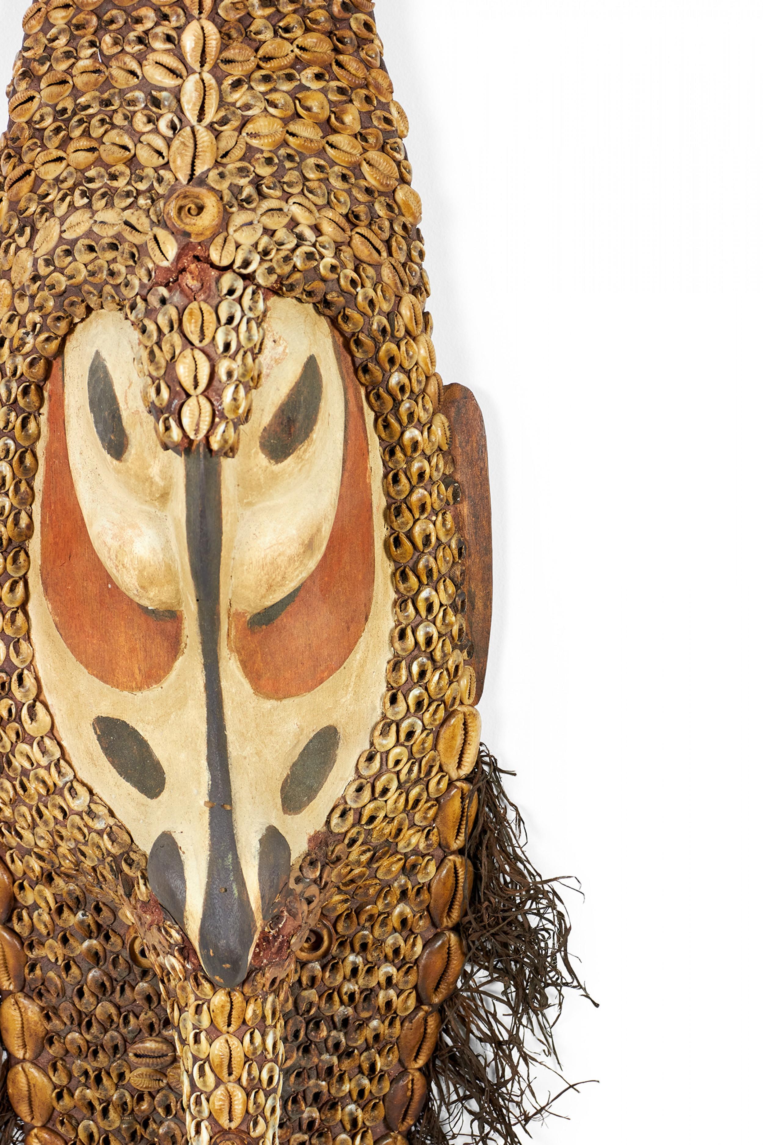 Hand-Carved African Cowrie Shell and Root Fiber Beaked Mask For Sale