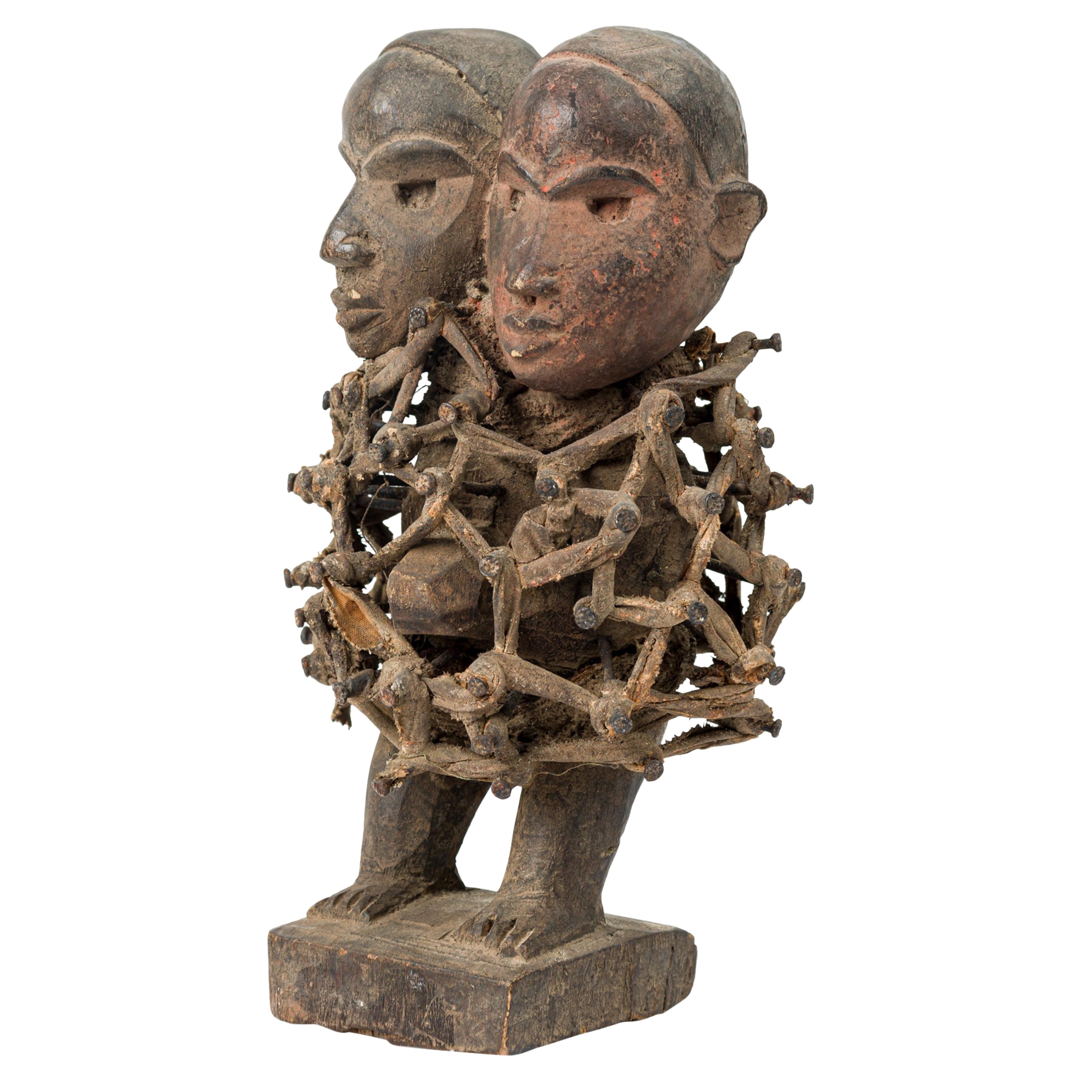 African D.R. Congo 20th Century Carved Wood Nkisi 2-Headed Nail Fetish Figure