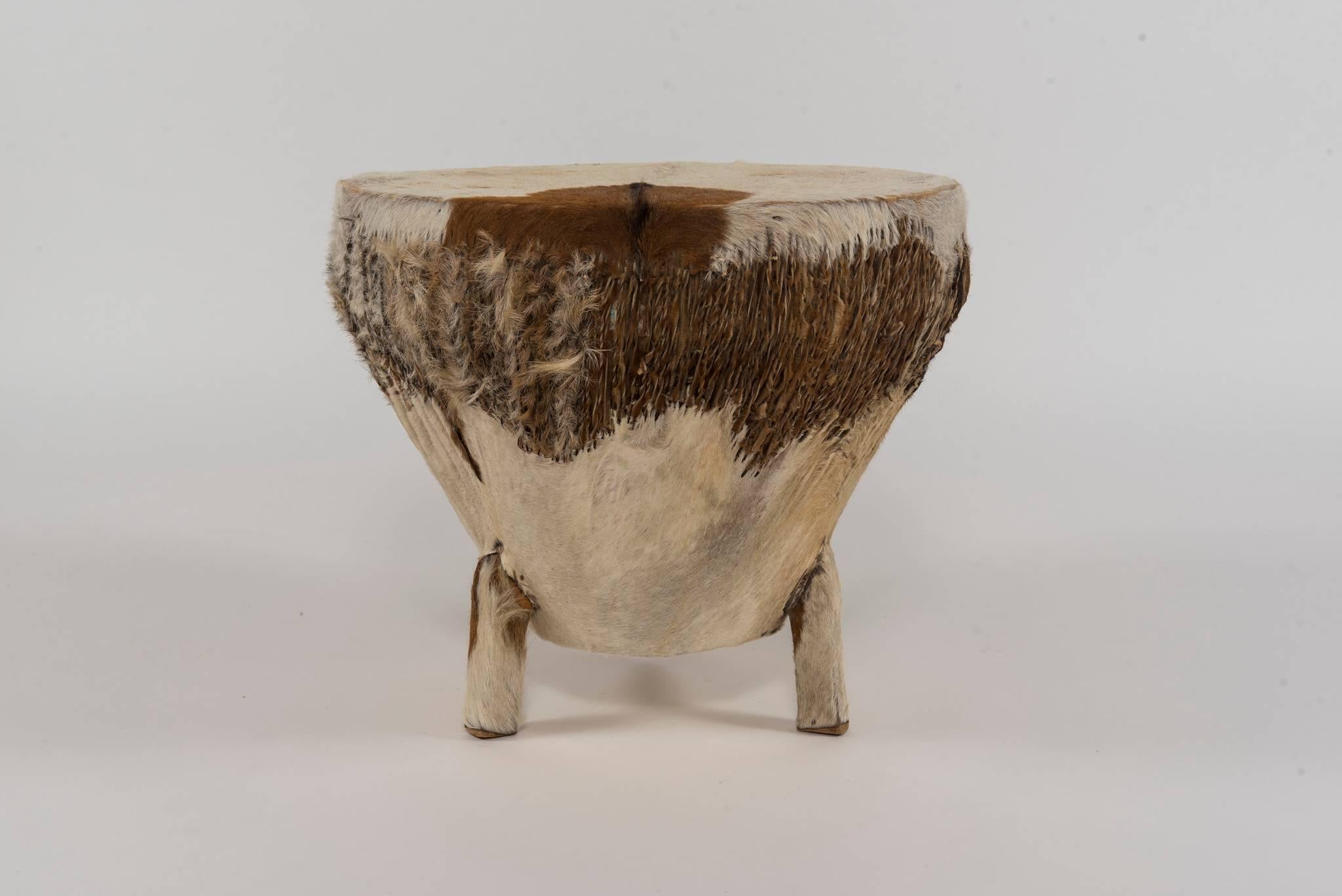 A 1970s African hand-carved hardwood drum made with stretched hides and twisted leather.