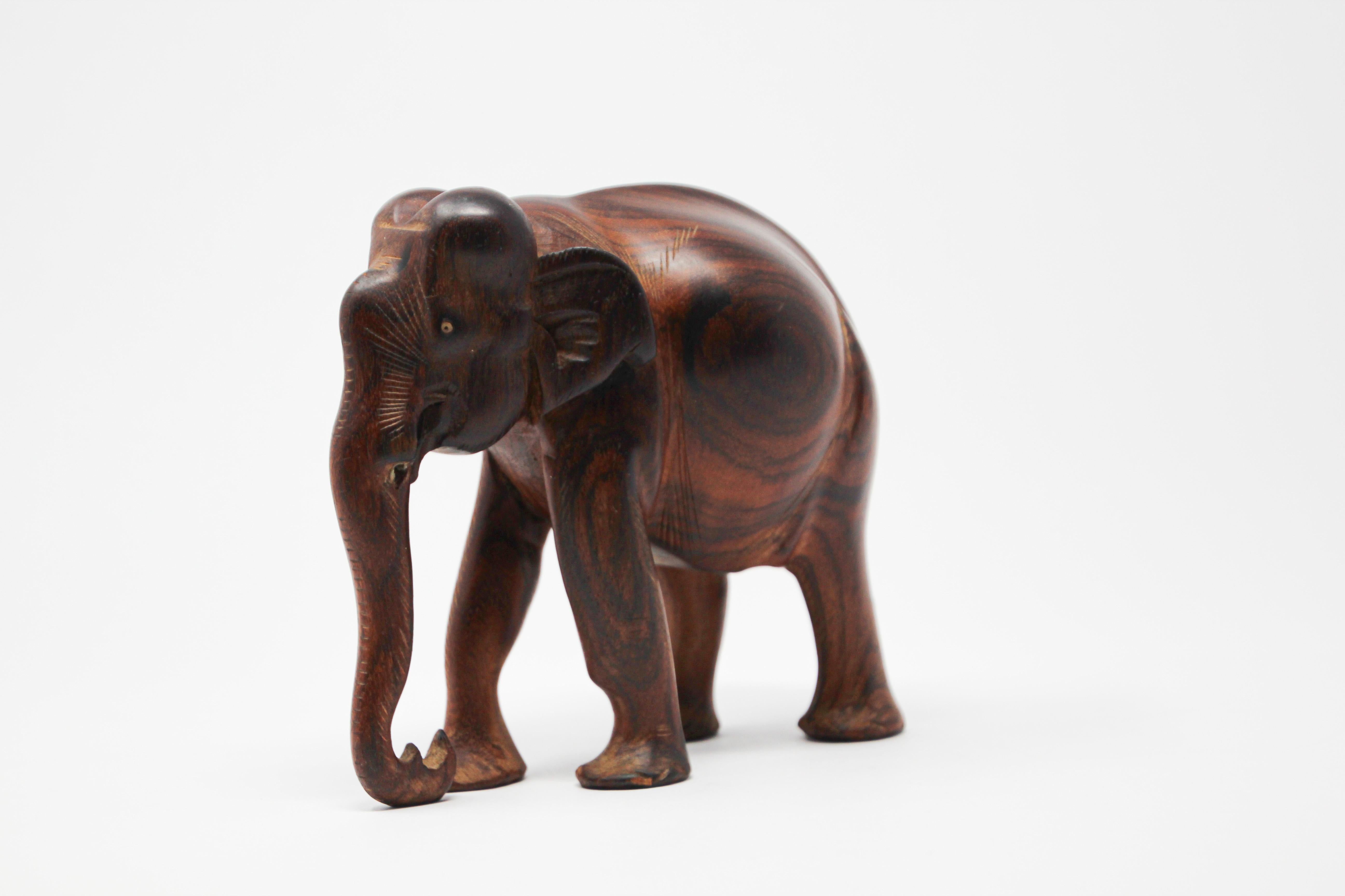 Hand carved wood ebony African elephant.
Handcrafted in Africa.