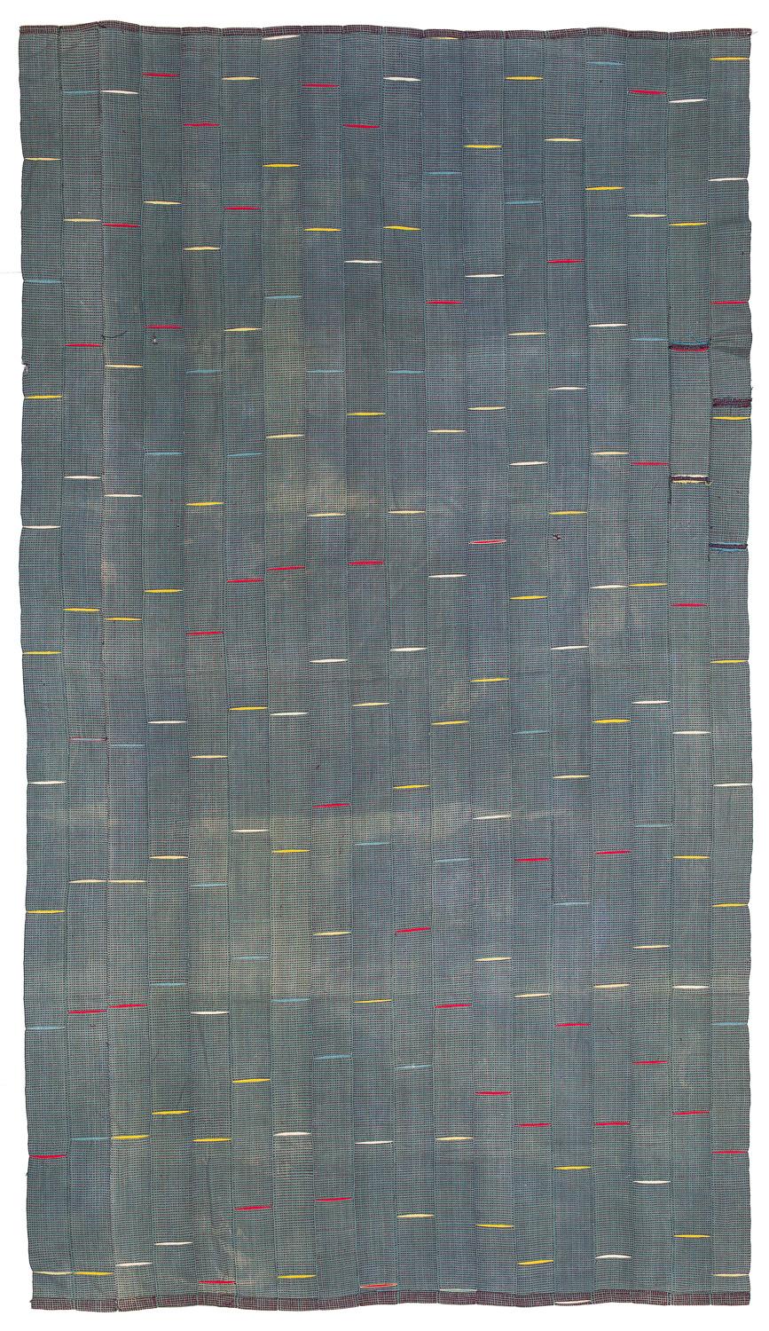 This is a very unusual textile, we haven't seen this exact pattern and coloration before. It has beautiful colors and an interesting texture from the hand spun cotton. This luxurious textile would make a great throw blanket or a wall hanging.