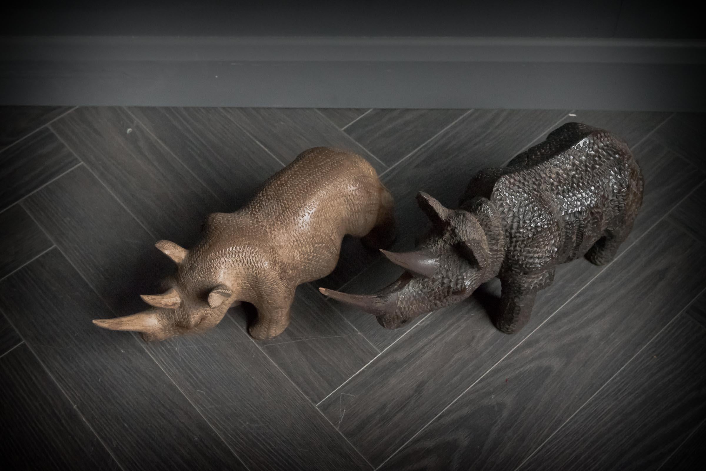 20th Century African Hand Carved Pair of Black and White Rhinos For Sale
