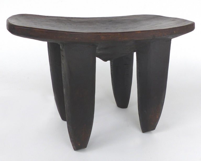 Offered for sale is a 20th century hand carved Senufo stool from Cote d'Ivoire. The stool is substantial, stabile and quite sensual. The wood shows lovely rustic textures of the hand carving. This stool can also be used as a side table.
Height