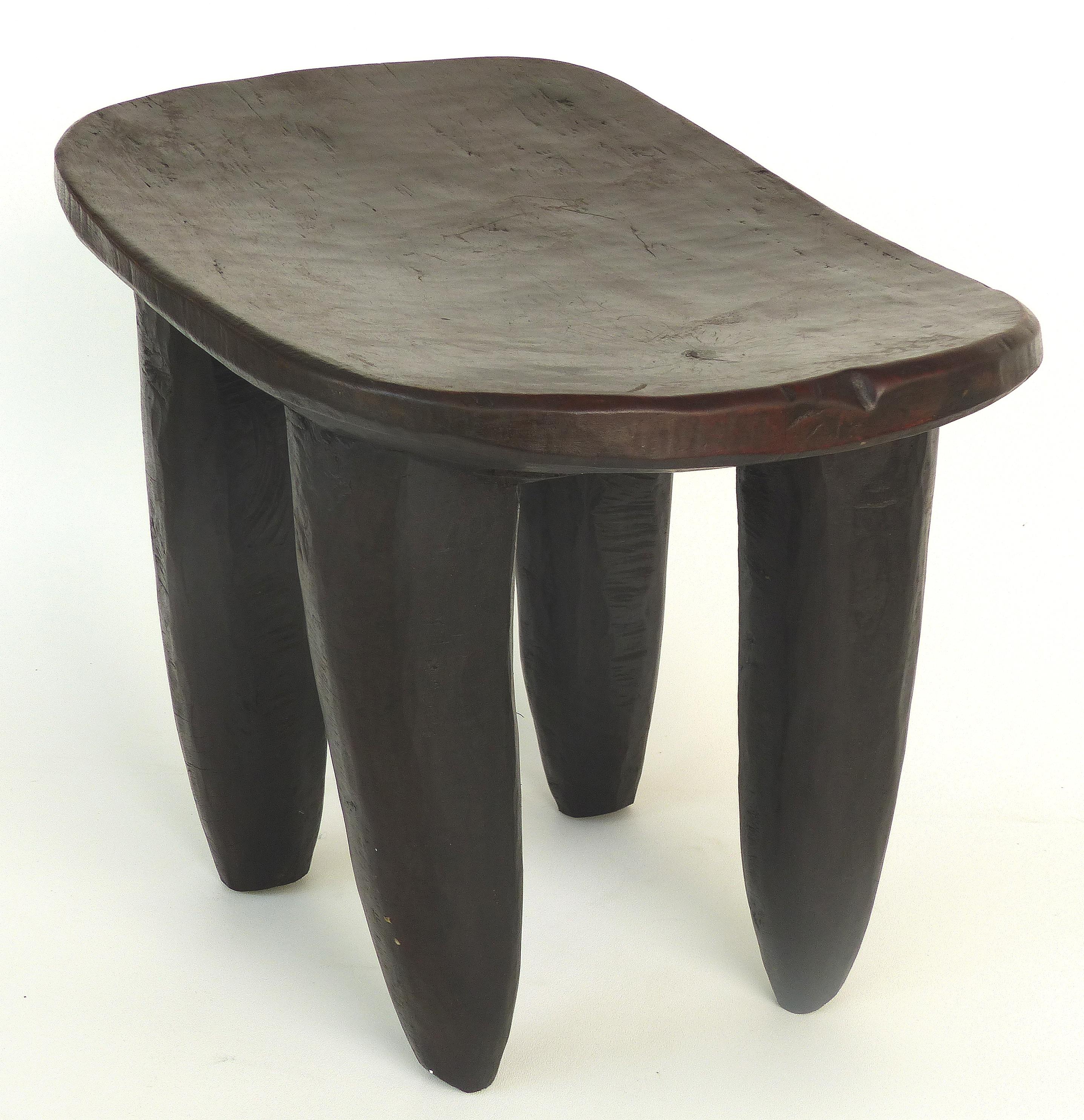 Offered for sale is an early 20th century hand-carved Senufo stool from Cote d'Ivoire. The chair is very stable and quite sensual. The wood shows lovely rustic textures of the hand carving. This stool can also be used as a side table.
Height