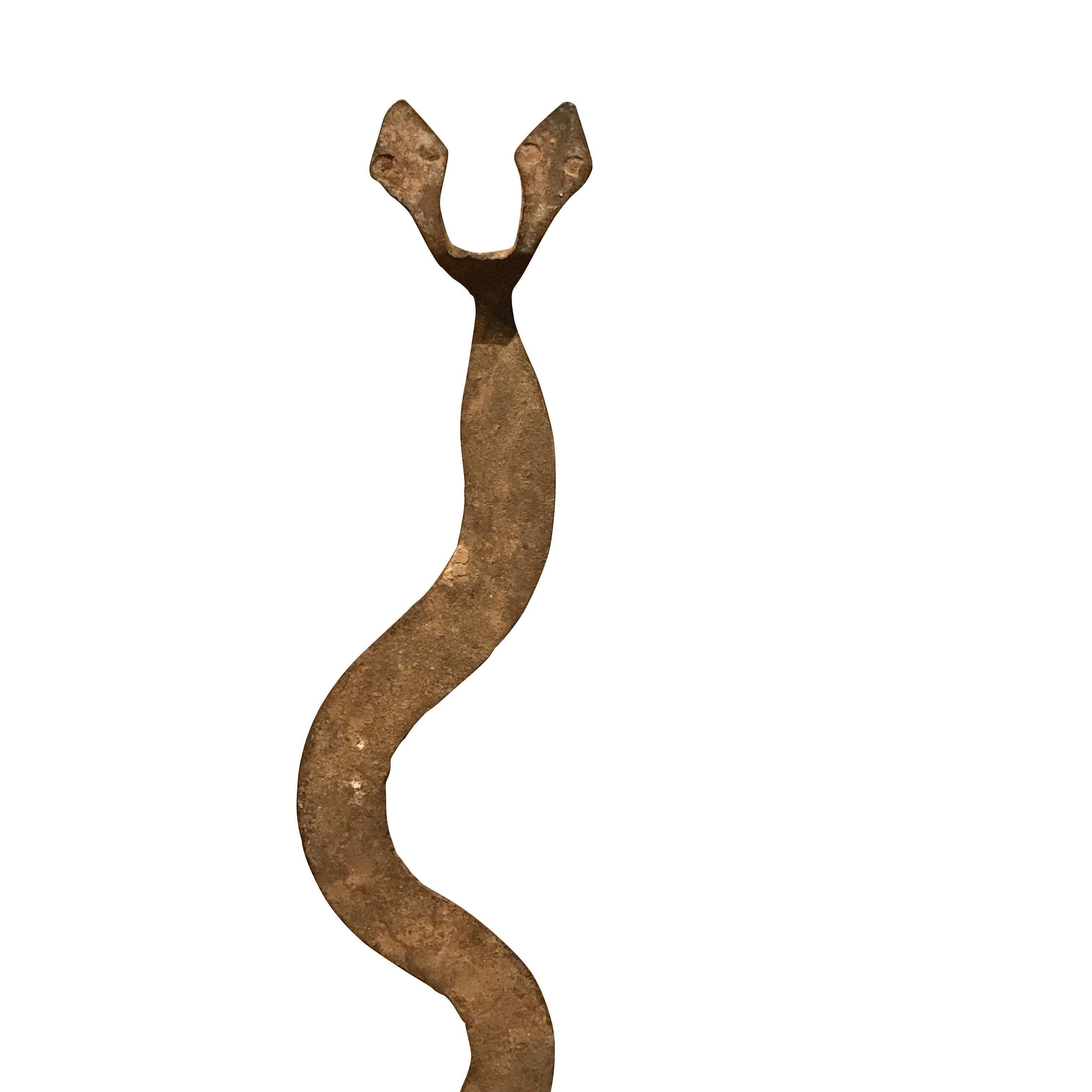 19th century iron snake sculpture on metal stand from the Lobi tribe in Burkina Faso, Africa
Naturally aged patina
Makes a great collection with S4589/90/92
Stand is steel and measures 4.5