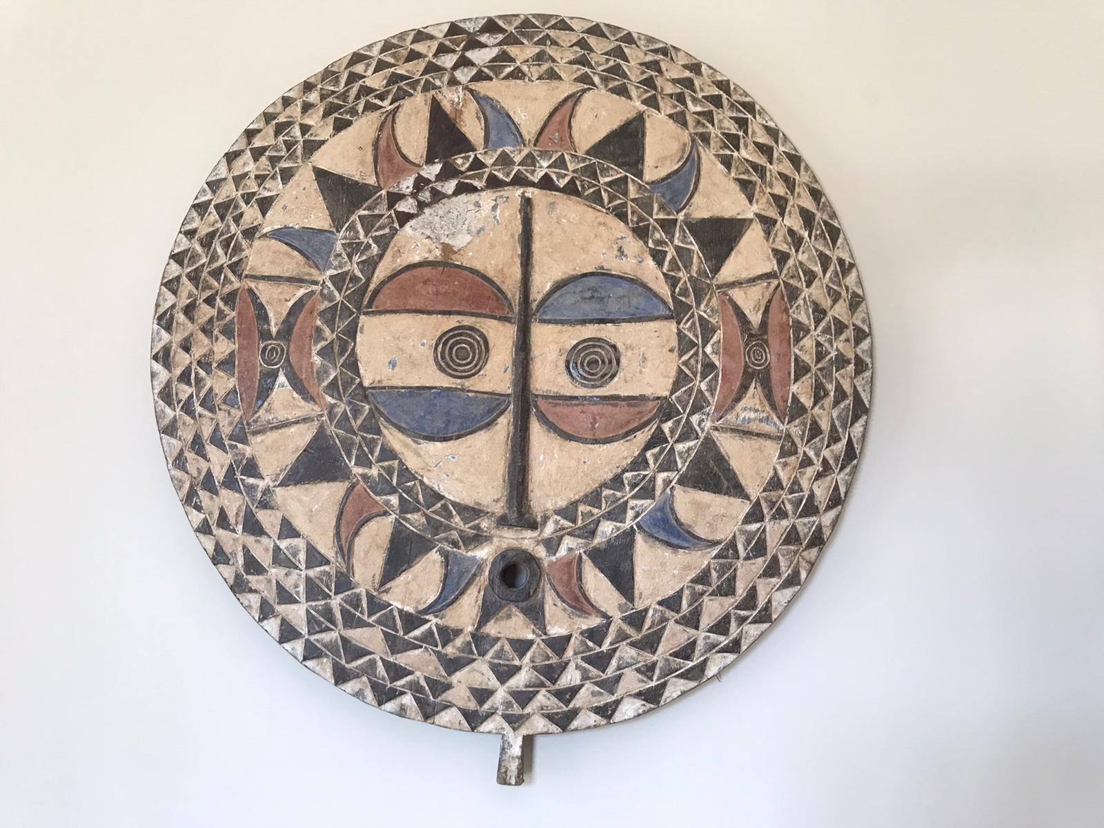 Hand painted wood mask. The geometric designs of each mask also carry various meanings. The light and dark pattern also symbolizes good from evil and female from male.