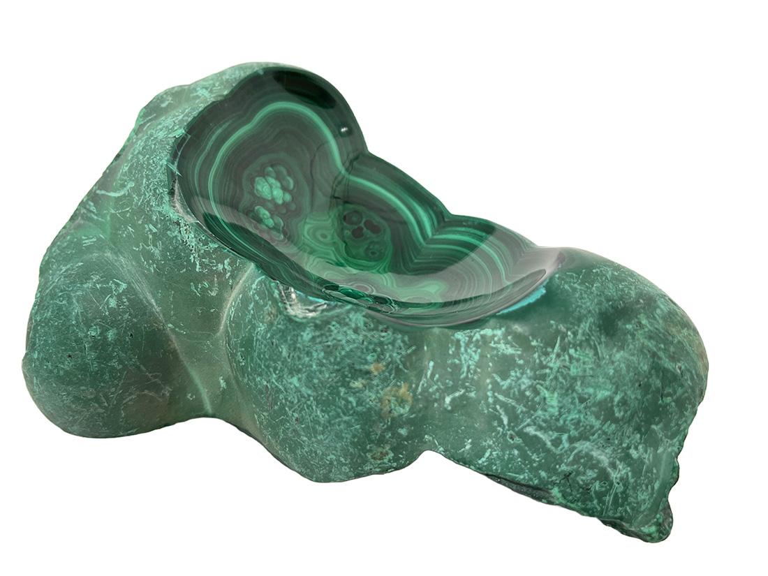 African Malachite bowls, 1970s

Malachite bowls made in an organic shape and partly polished, which gives the top a shine. 
One bowl is polished above, one is partly in the middle polished and the third one is matted
African Malachite 1970s.