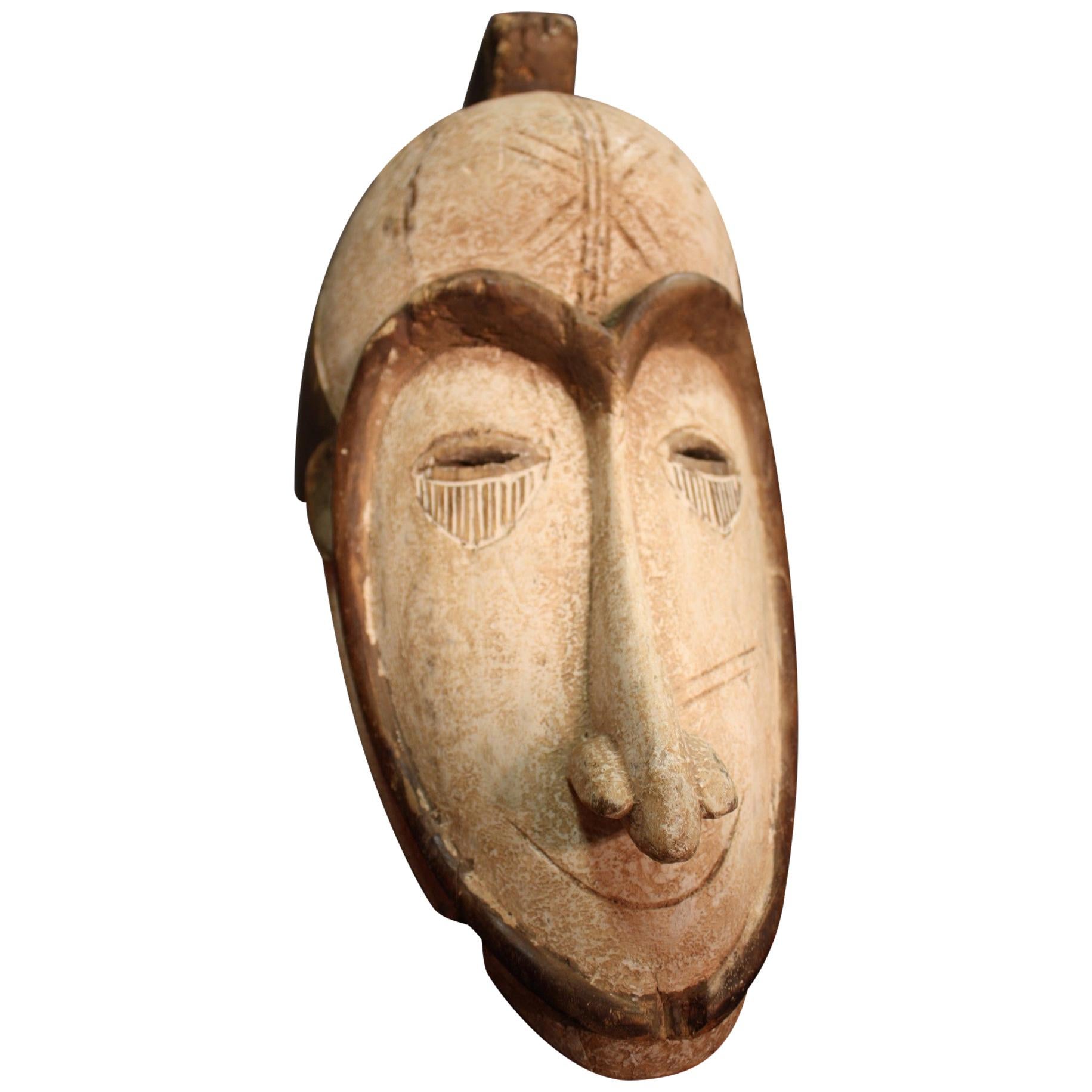 African Mask Carved in Wood, 20th Century For Sale