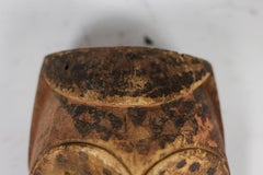 African mask “Kuba Babuka” in wood and pigments. 20th century.