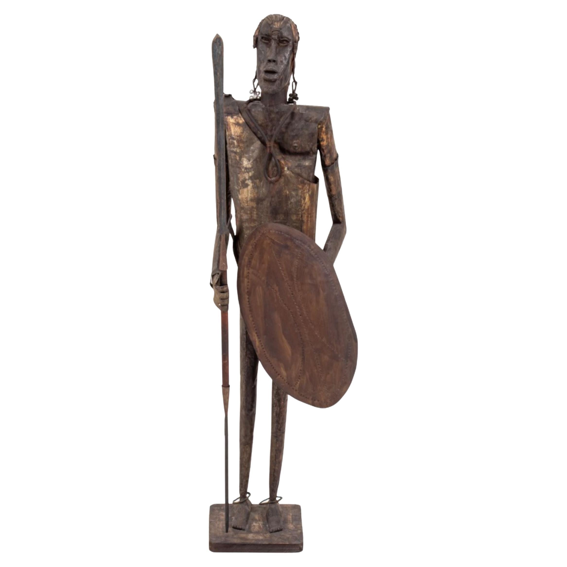 Sculpture en métal d'un guerrier africain/océanique signée