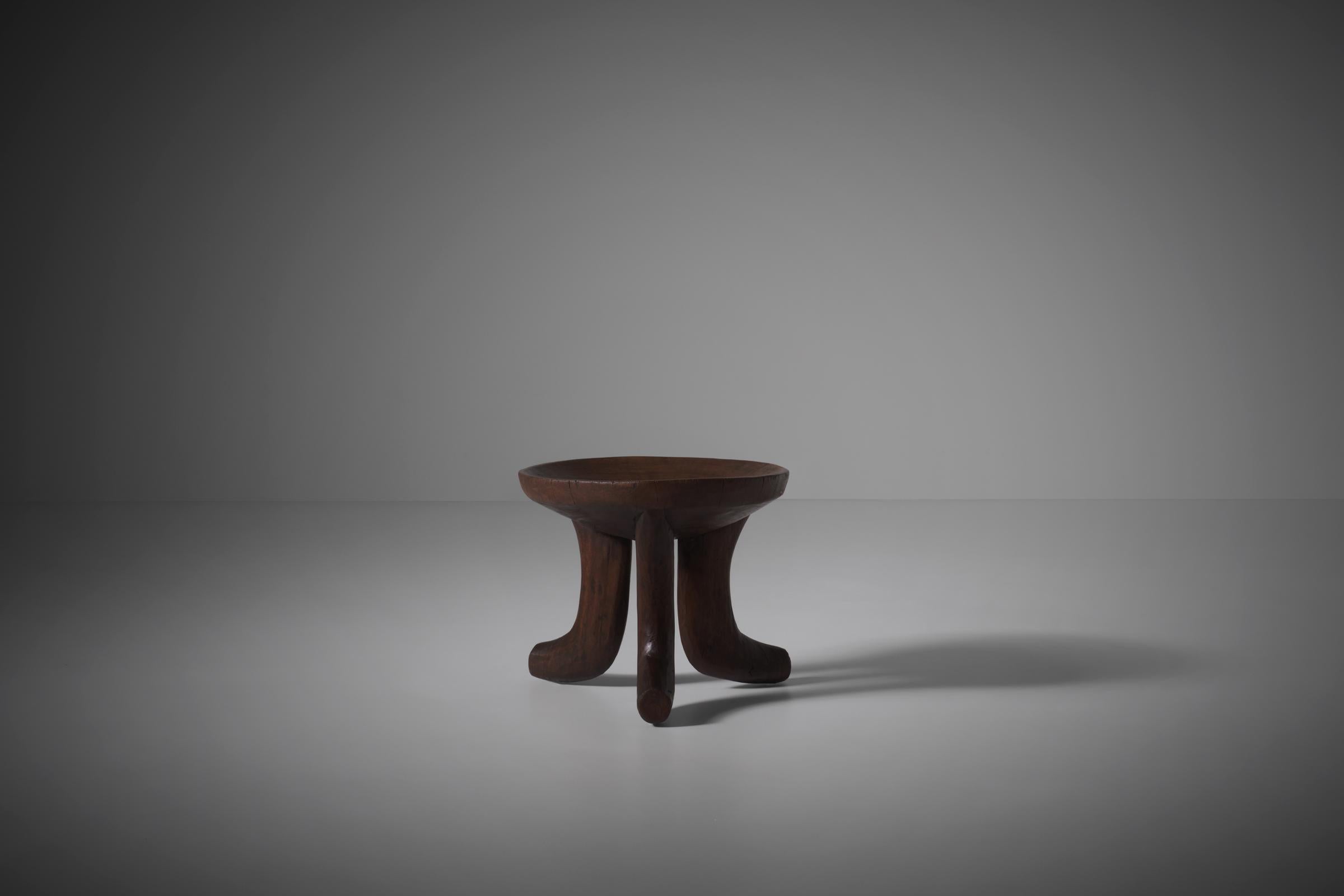 Original hand carved African 'Oromo' stool, Ethiopia early 20th century. Very nice design carved out of one solid piece of wood. The beautifully round bowled seat is supported by three curved legs. Very decorative object with a characteristic patina.
