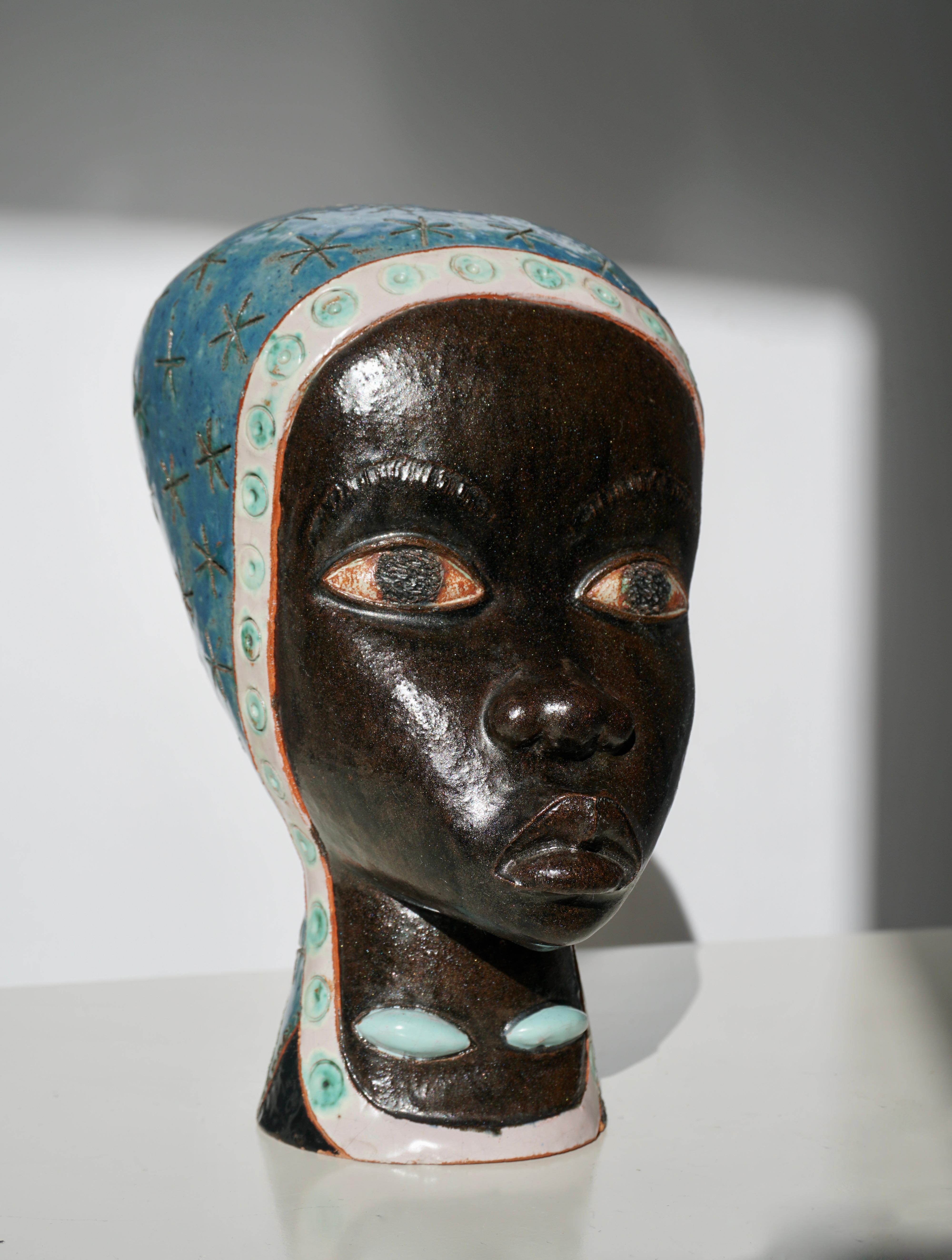 African Woman glazed terracotta sculpture signed by Artist L. Zoao.



One-Of-A-Kind Terracotta bust.
 