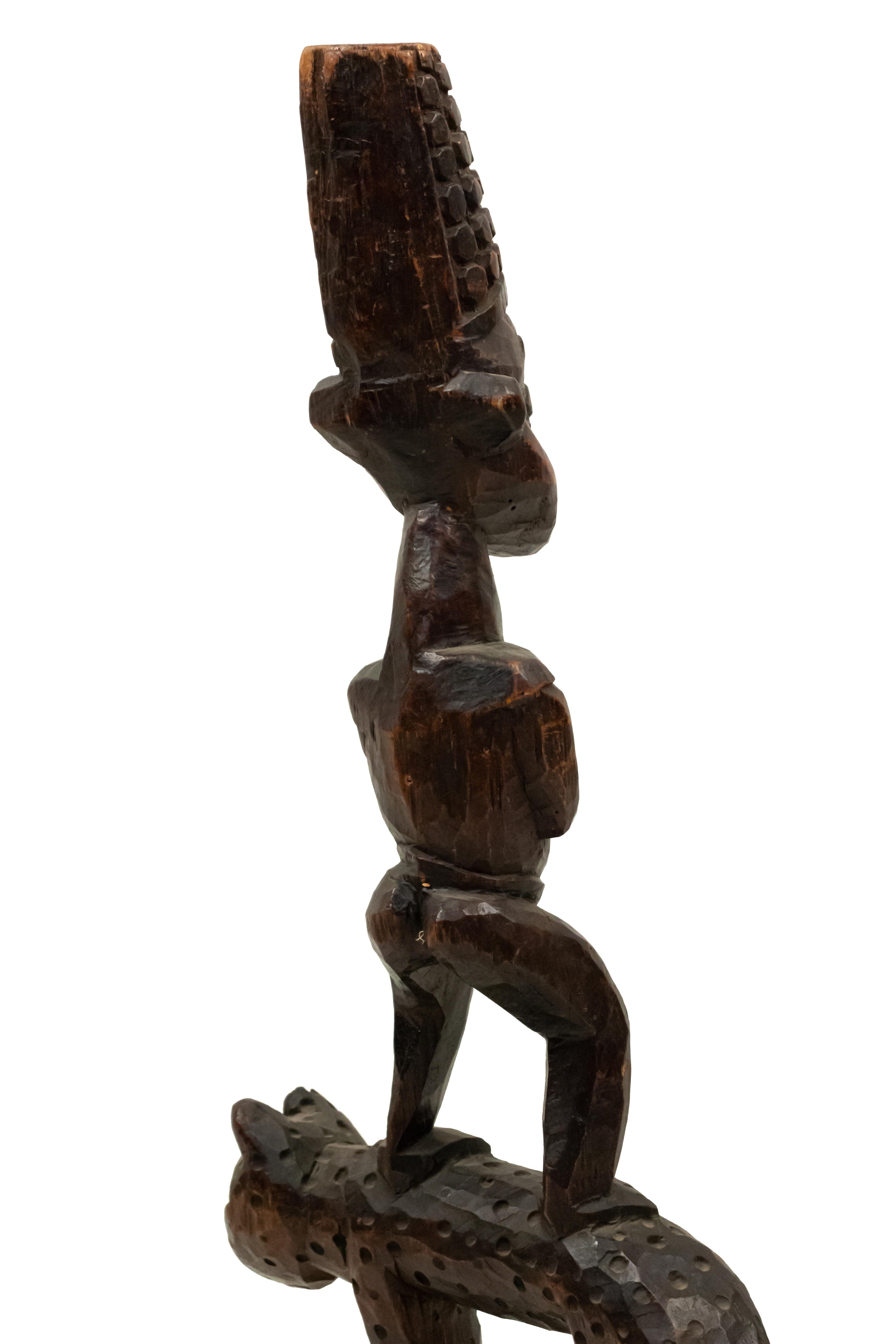 African Sculpture of a Figure Standing on a Leopard For Sale 1