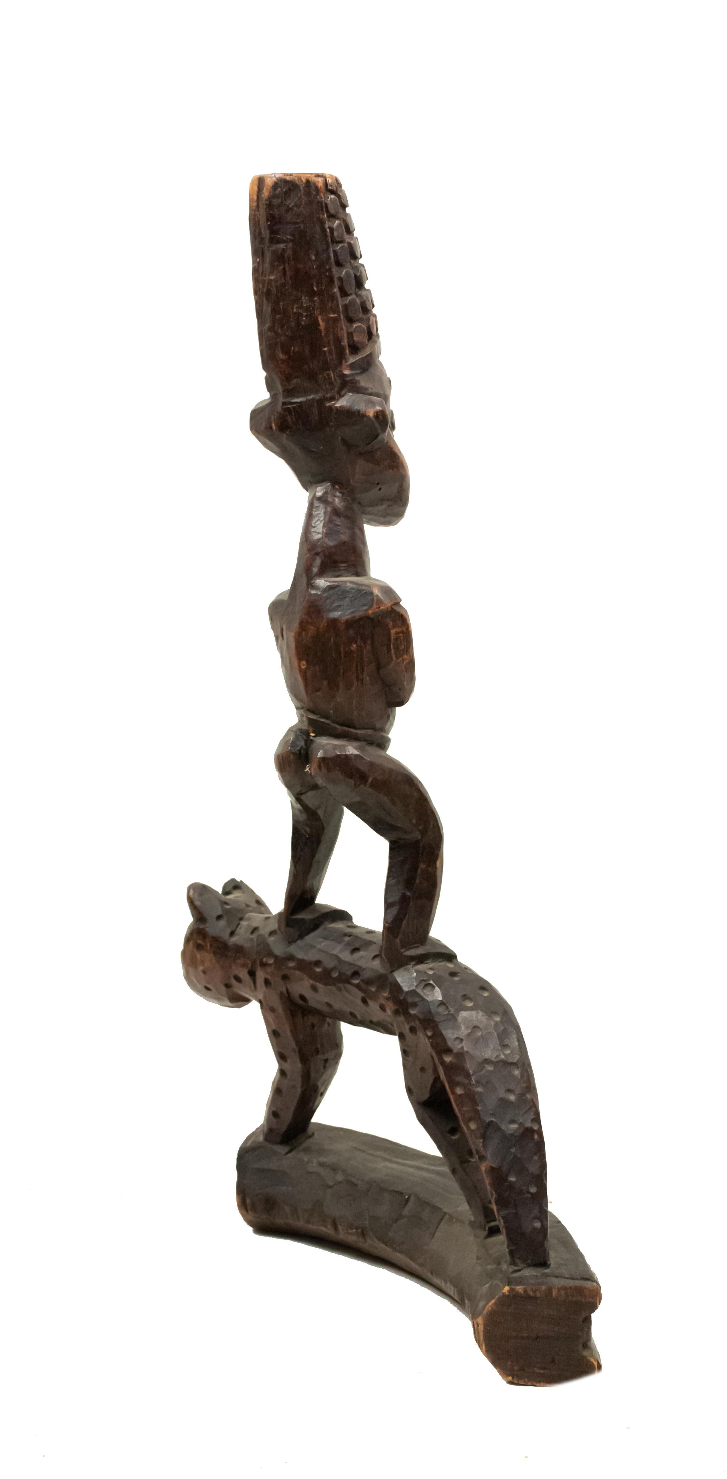 Wood African Sculpture of a Figure Standing on a Leopard For Sale