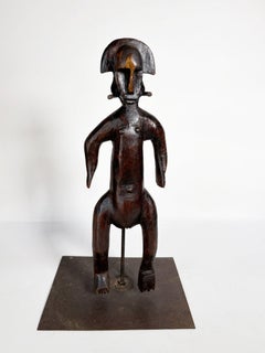 African sculpture of a man in wood, France, 1920