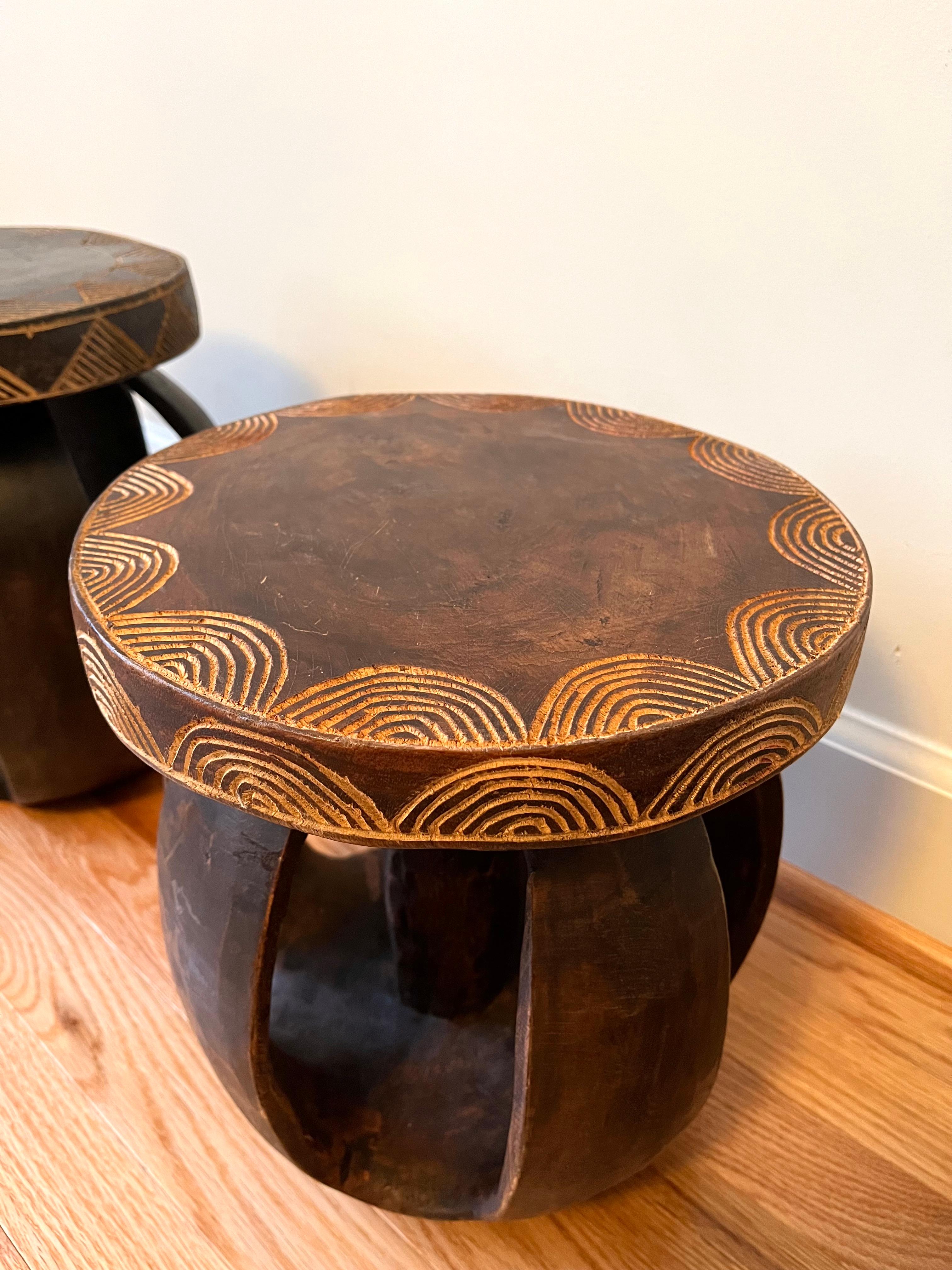 These Senufo stools are hand carved from hardwood by the Senufo Tribe in the Ivory Coast. 

Senufo stools are known for their stocky tapered legs and concave tops and are traditionally carved from one block of wood. 

Artisan crafted and due to