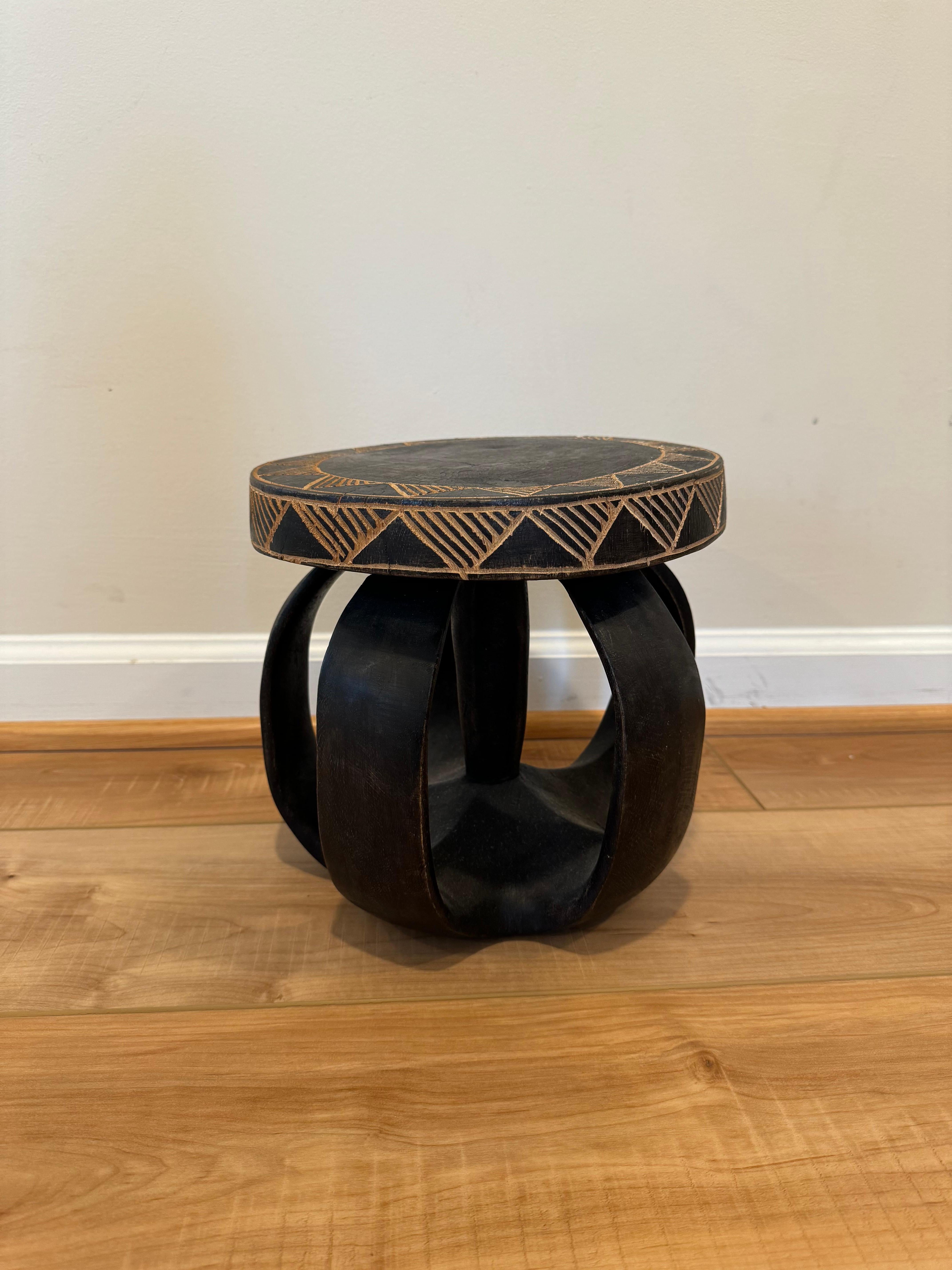 These Senufo stools are hand carved from hardwood by the Senufo Tribe in the Ivory Coast. 

Senufo stools are known for their stocky tapered legs and concave tops and are traditionally carved from one block of wood. 

Artisan crafted and due to its