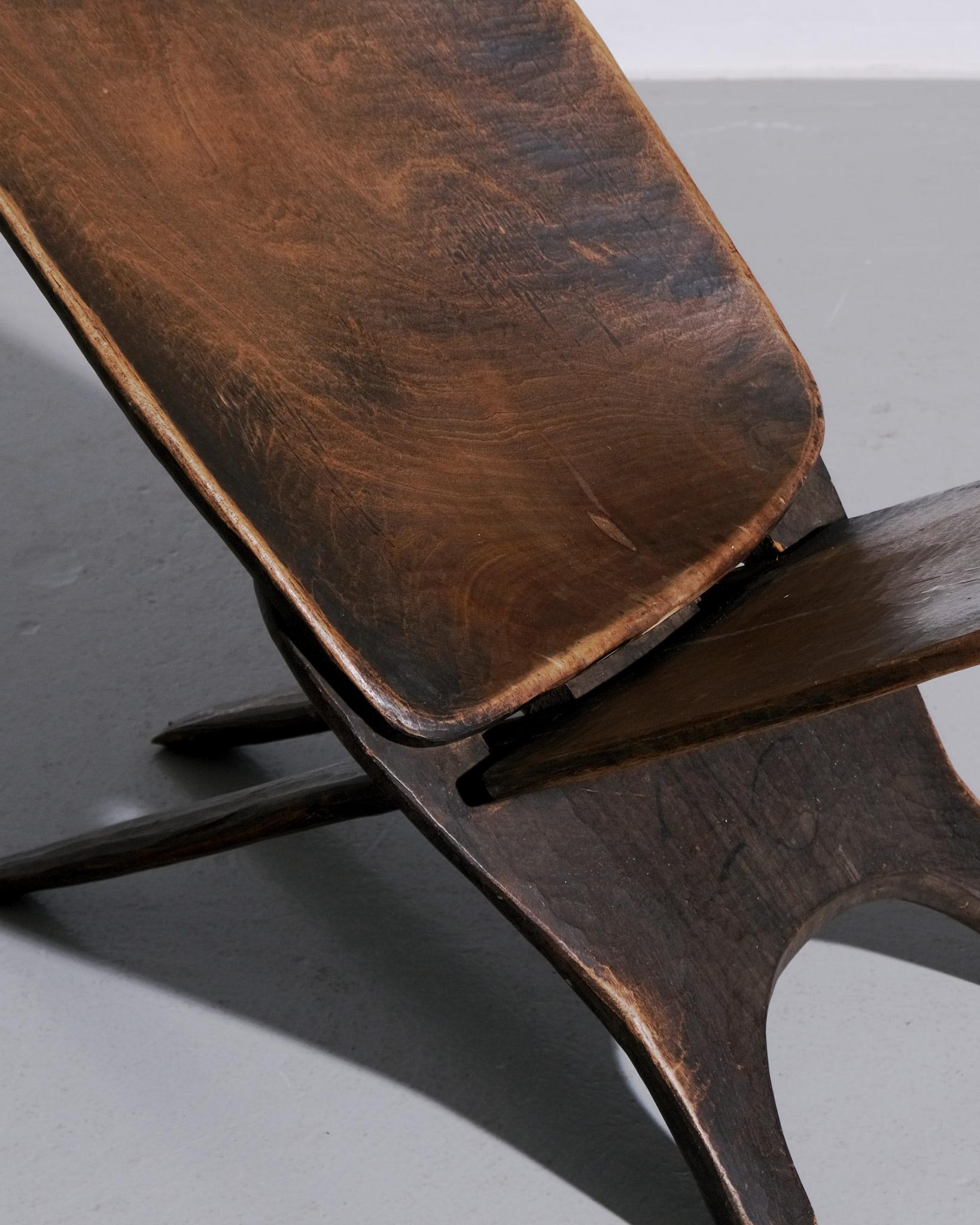 A beautifully sculptural Senufo stargazer chair from West Africa, traditionally made by the Senufo people of Côte d’Ivoire. Crafted using time-honoured techniques, the chair features a low, wide seat and a dramatically reclined backrest — a form