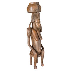 African Statue Depicting a Female Figure in Carved Wood