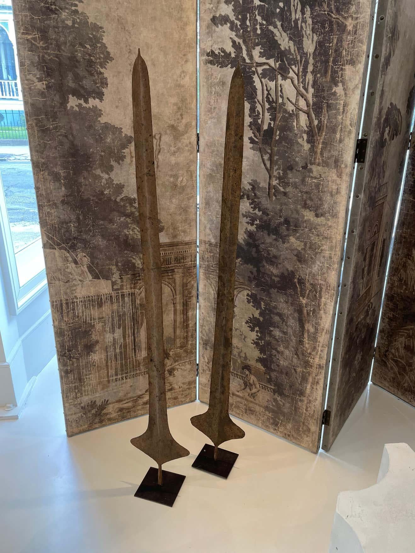 African currency sword that was used in the Congo for important transactions such as dowry or land purchases. The patina and sculptural shape give the feel of contemporary art mixed with 19th century history. Displayed on metal stand.
