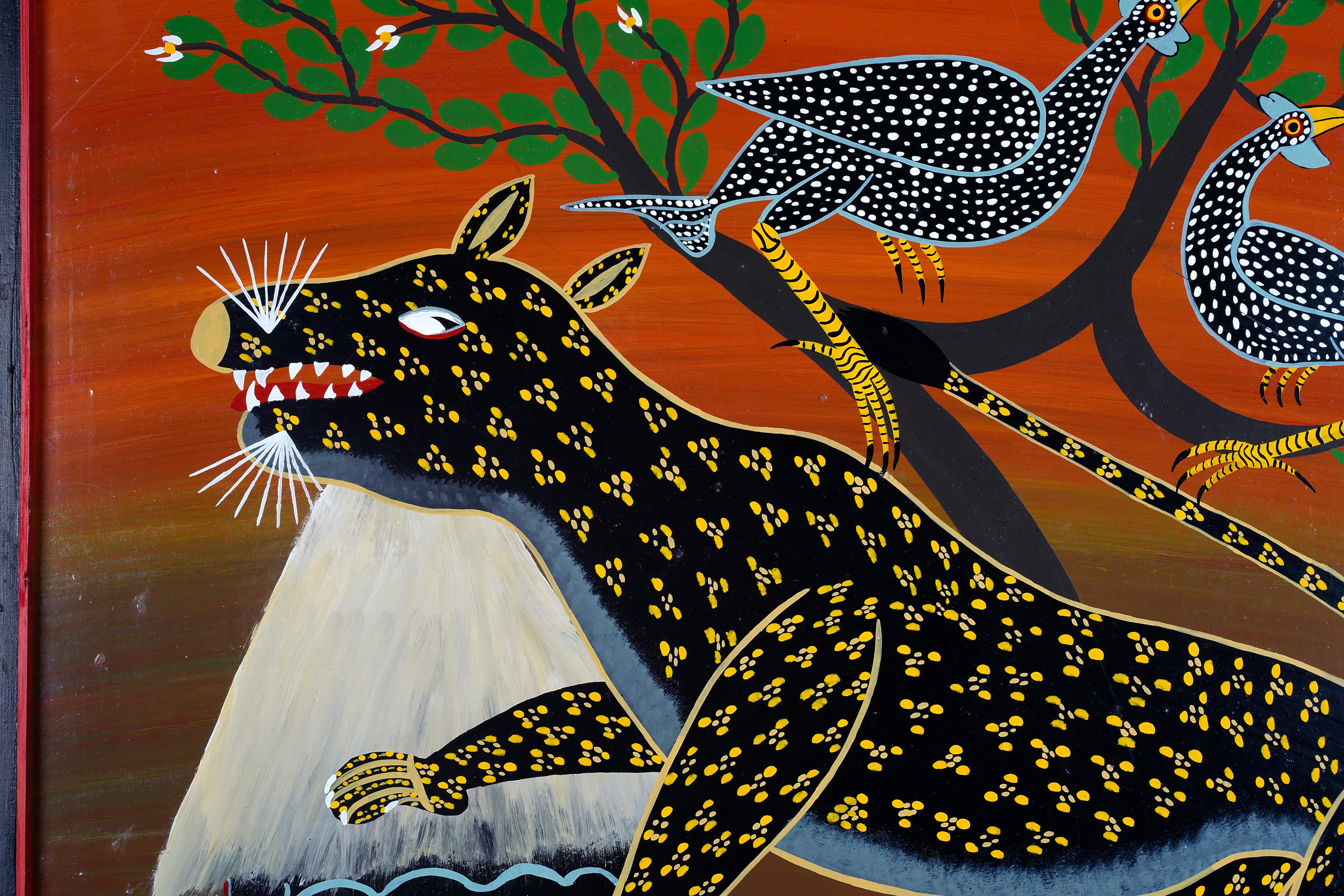 A Tingatinga painting by unknown artist from the 1970s. Signed R.N Millanzi. It is painted on masonite and has a thin black frame. 

Naive motif in bold colours with leopard, birds and hut.

The painting has minor color loss, scratches and marks.
