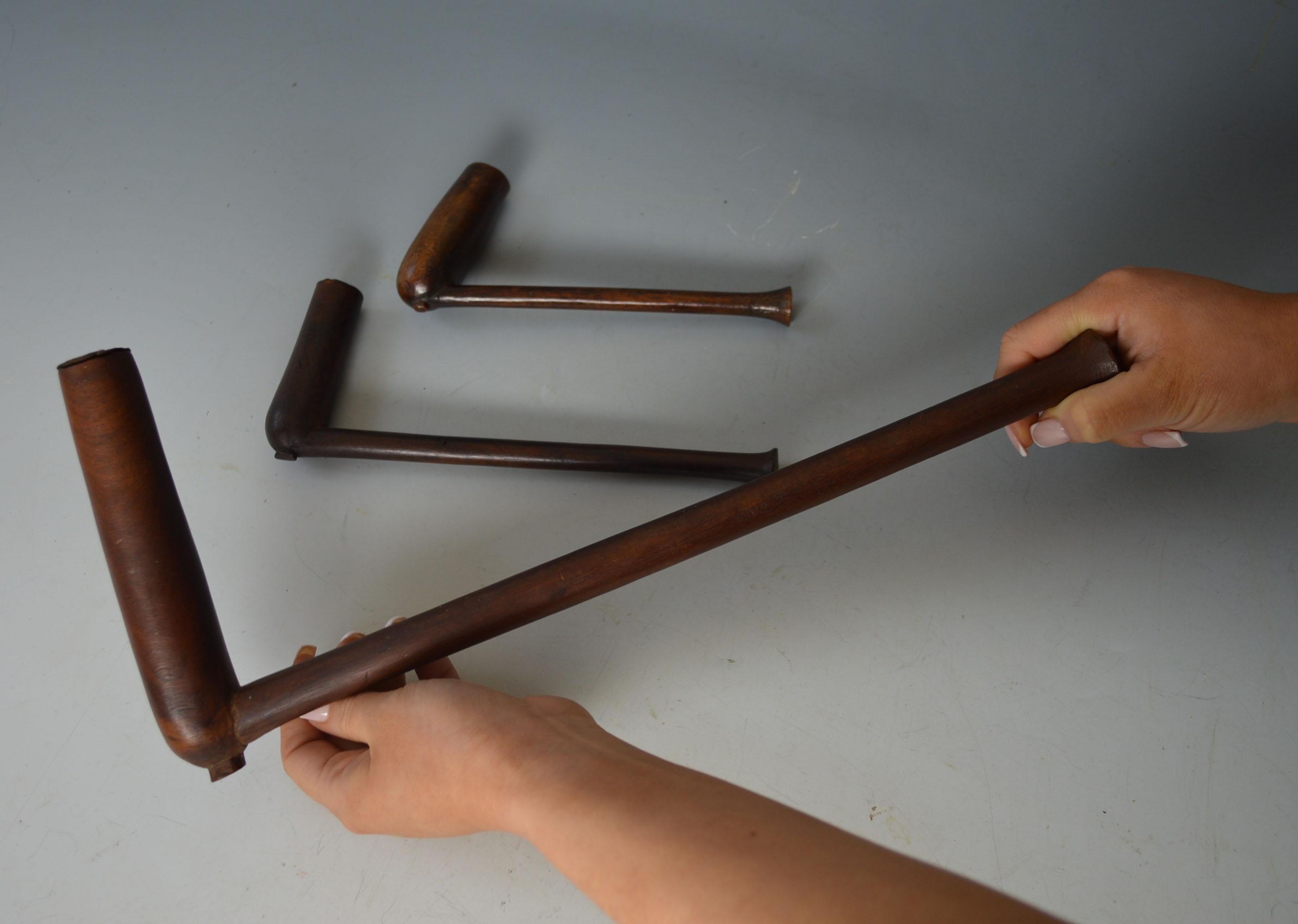 Zulu /  Nguni Pipe Group South Africa
Carved wood with metal liners, one rare very large sized pipe
Lengths 14, 8, 7 inches  36, 20, 17.5 cm
Period Late 19th early 20th century.