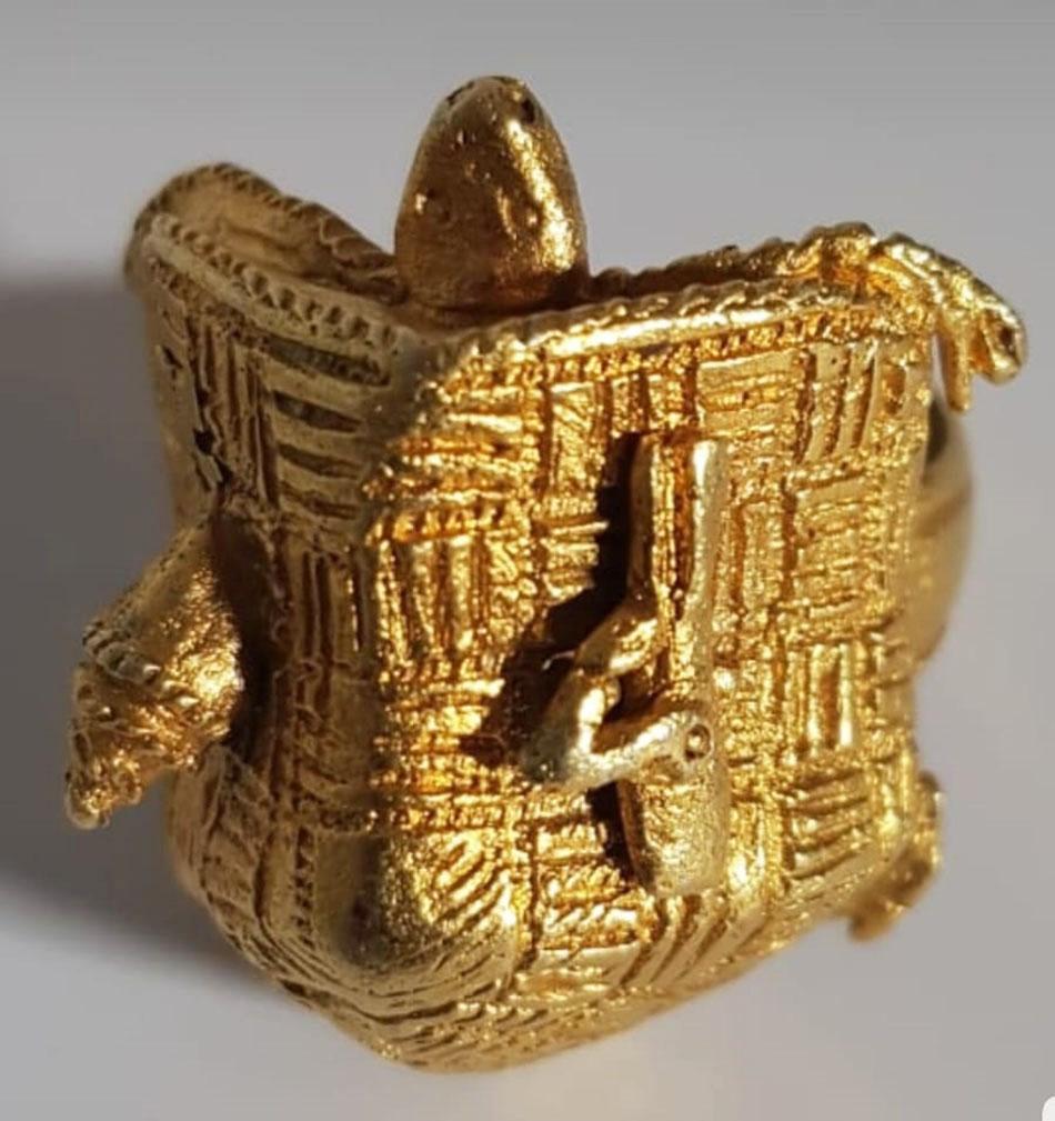 A fine old Ashanti Chiefs gold ring 
A very fine quality gold ring in the form or a turtle in a dwelling with a shell and flint lock pistol on the surface of the turtles shell.
From the Kumuwu region of the Ashanti kingdom. 
The turtle is a symbol
