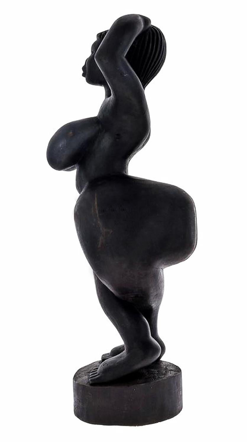 Beautiful large African Art Female Figure Decade of 50. In carved ebonized wood, representing female figure with hyperbolic characteristics.

Private collection.