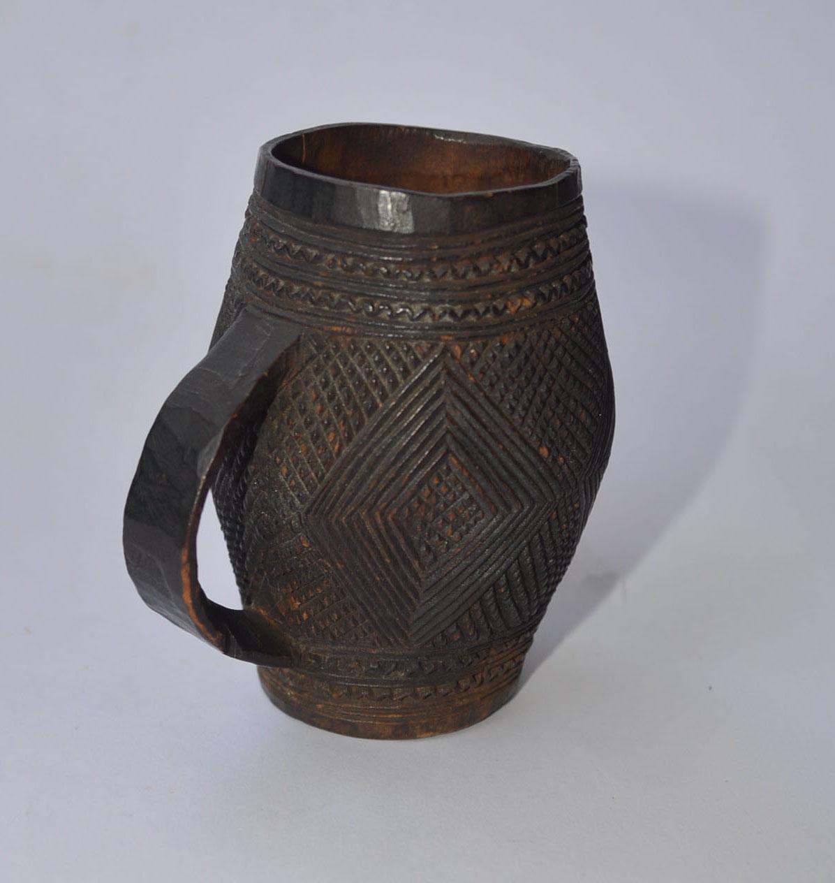 Rare Kuba miniature Palm wine cup 

This finely carved cup would have been used at celebratory rituals and wedding feasts. 

Period: early 20th century

Measures: H 3 1/2 inches 8.5 cm

Provenance: Belgian Colonial collection, Alain Guisson